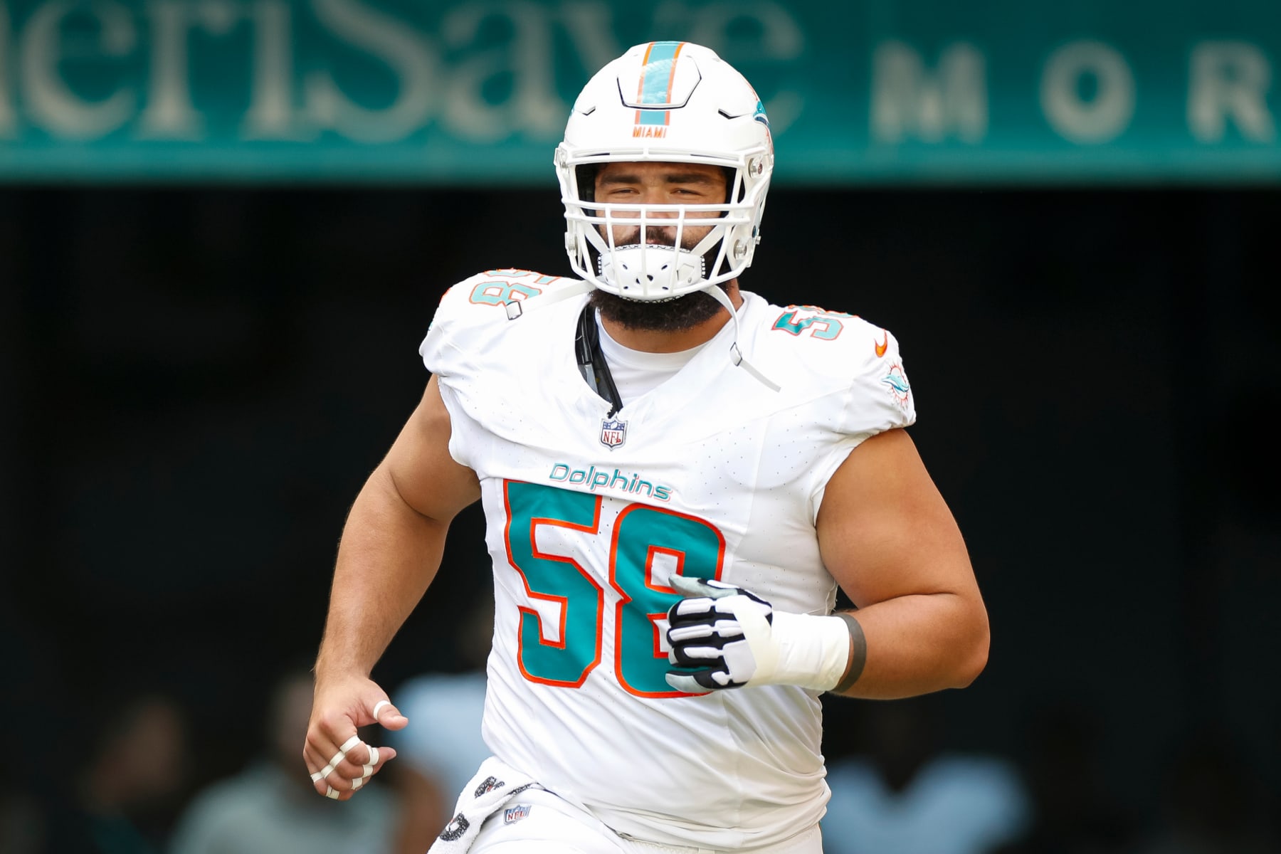 MIAMI GARDENS, FLORIDA - OCTOBER 8: Connor Williams #58 of the Miami Dolphins runs out of the tunnel during player introductions prior to a game against the New York Giants at Hard Rock Stadium on October 8, 2023 in Miami Gardens, Florida. (Photo by Brandon Sloter/Image Of Sport/Getty Images)