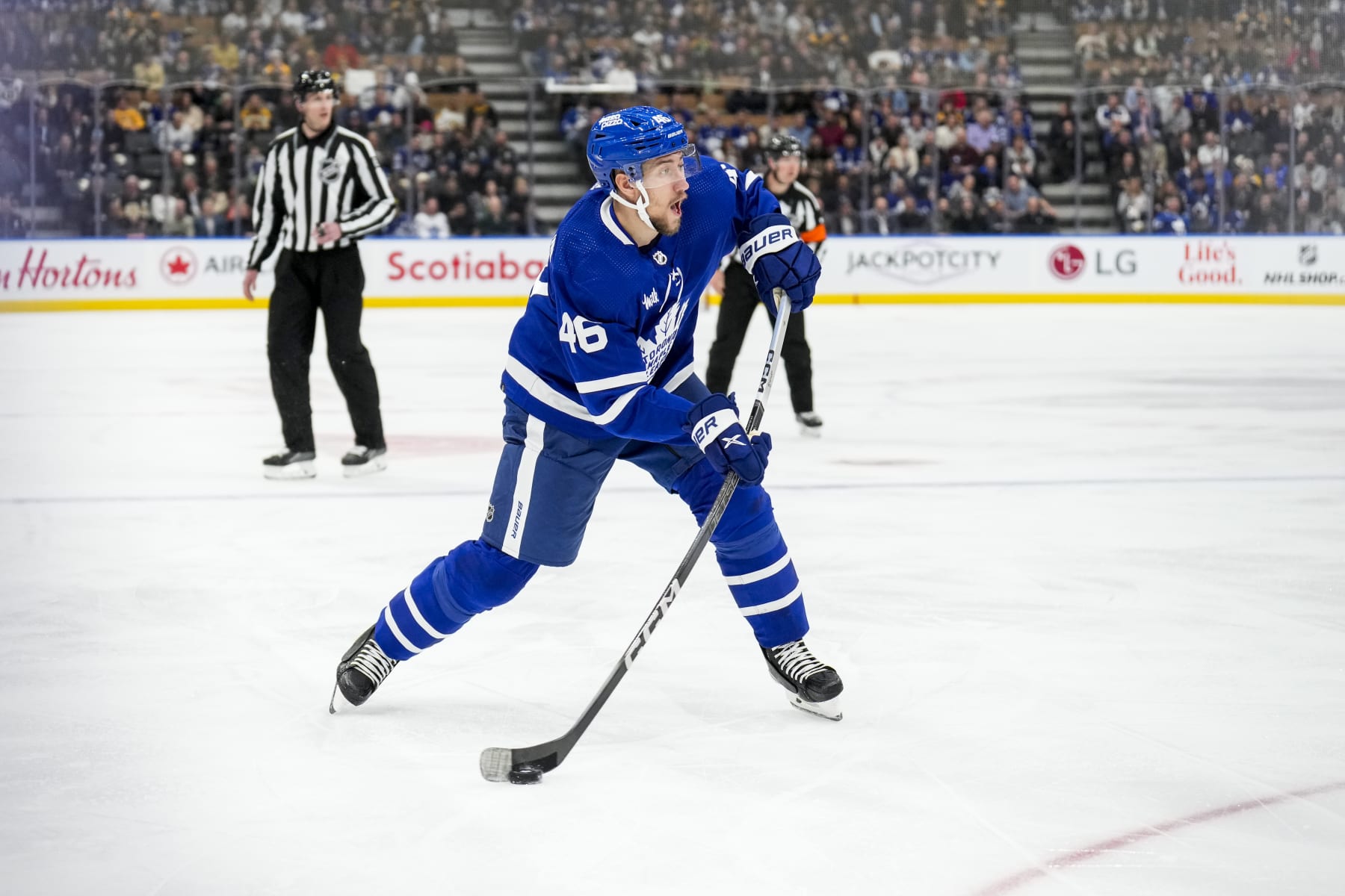 TORONTO, ON - MARCH 4: Ilya Lyubushkin #46 of the Toronto Maple Leafs shoots the puck against the Boston Bruins during the first period at Scotiabank Arena on March 4, 2024 in Toronto, Ontario, Canada. (Photo by Andrew Lahodynskyj/NHLI via Getty Images)