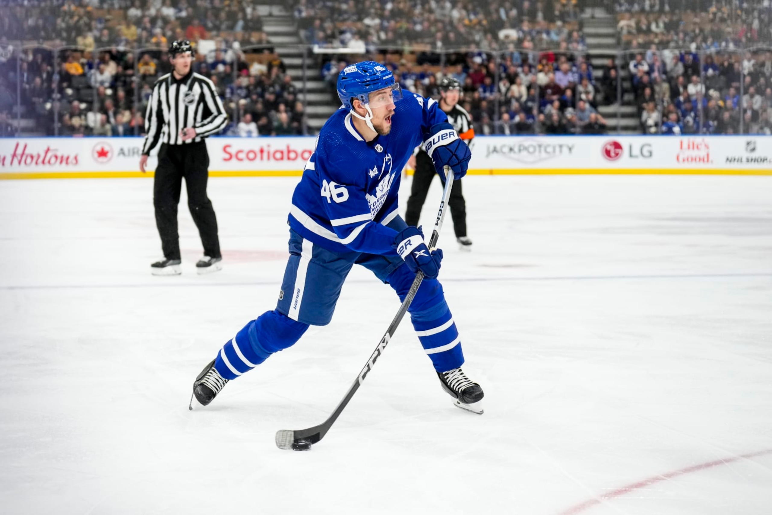 TORONTO, ON - MARCH 4: Ilya Lyubushkin #46 of the Toronto Maple Leafs shoots the puck against the Boston Bruins during the first period at Scotiabank Arena on March 4, 2024 in Toronto, Ontario, Canada. (Photo by Andrew Lahodynskyj/NHLI via Getty Images) TORONTO, ON - MARCH 4: Ilya Lyubushkin #46 of the Toronto Maple Leafs shoots the puck against the Boston Bruins during the first period at Scotiabank Arena on March 4, 2024 in Toronto, Ontario, Canada. (Photo by Andrew Lahodynskyj/NHLI via Getty Images)