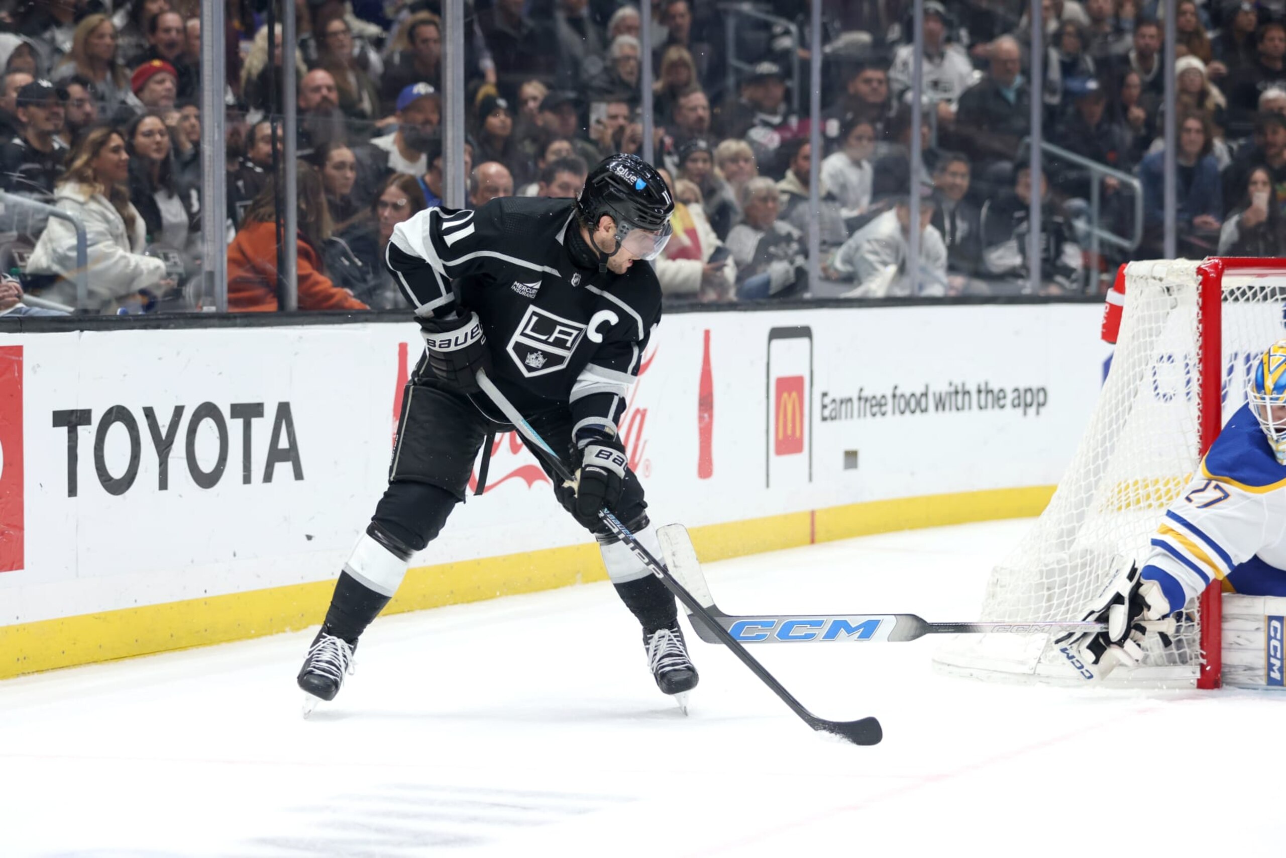 LOS ANGELES, CALIFORNIA - JANUARY 24: Anze Kopitar #11 of the Los Angeles Kings controls the puck in the third period during the game against the Buffalo Sabres at Crypto.com Arena on January 24, 2024 in Los Angeles, California. (Photo by Nicole Vasquez/NHLI via Getty Images) LOS ANGELES, CALIFORNIA - JANUARY 24: Anze Kopitar #11 of the Los Angeles Kings controls the puck in the third period during the game against the Buffalo Sabres at Crypto.com Arena on January 24, 2024 in Los Angeles, California. (Photo by Nicole Vasquez/NHLI via Getty Images)