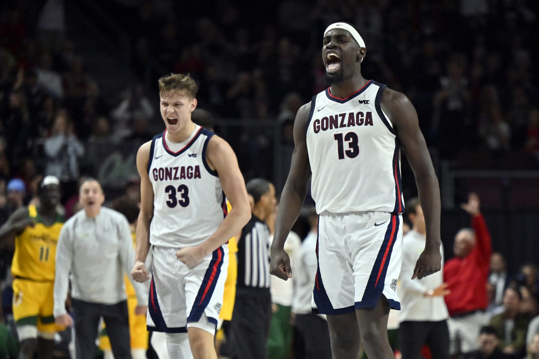 LAS VEGAS, NEVADA - MARCH 11: Ben Gregg #33 and Graham Ike #13 of the Gonzaga Bulldogs react after a three-pointer against the San Francisco Dons in the first half of a semifinal game of the West Coast Conference basketball tournament at the Orleans Arena on March 11, 2024 in Las Vegas, Nevada.  (Photo by David Becker/Getty Images)