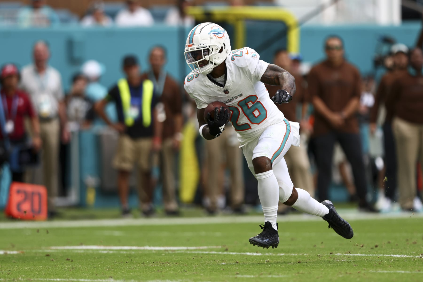 MIAMI GARDENS, FL - NOVEMBER 19: Salvon Ahmed #26 of the Miami Dolphins carries the ball during an NFL football game against the Las Vegas Raiders at Hard Rock Stadium on November 19, 2023 in Miami Gardens, Florida. (Photo by Kevin Sabitus/Getty Images)