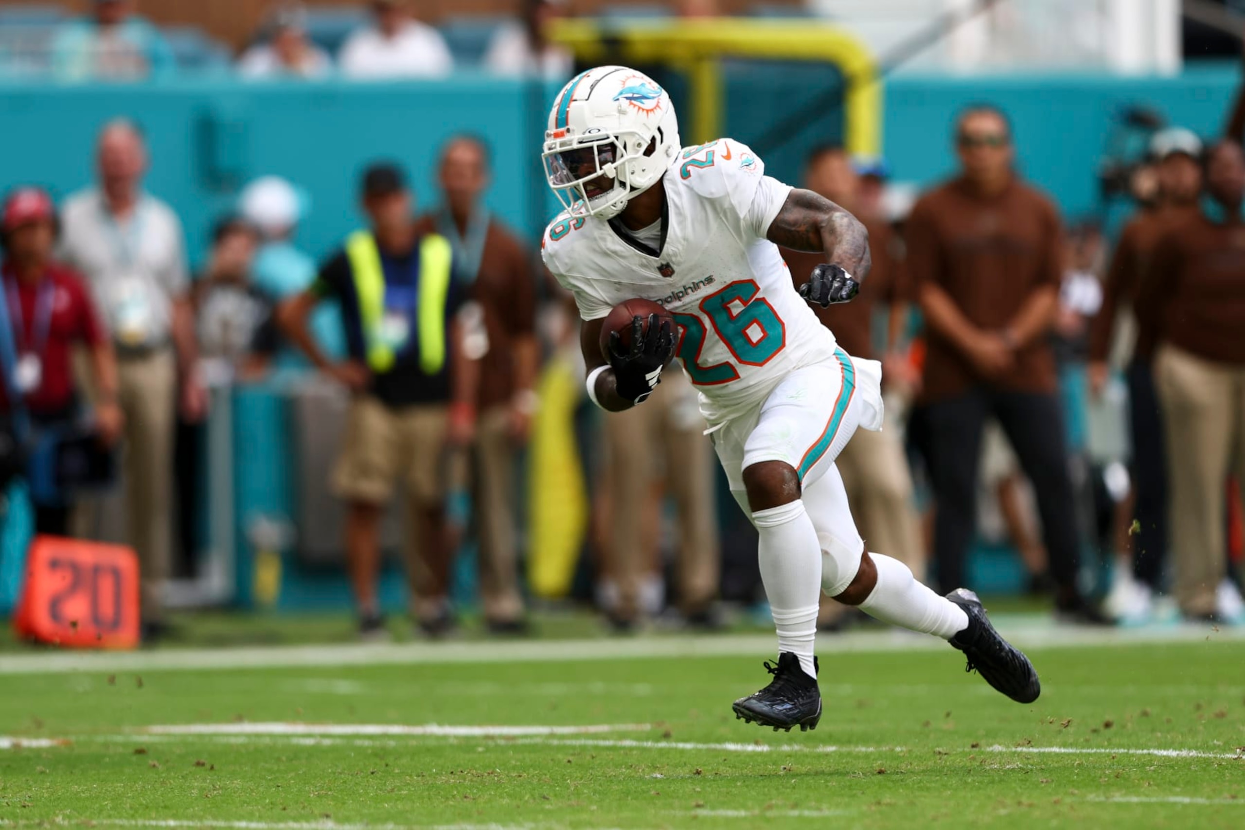 MIAMI GARDENS, FL - NOVEMBER 19: Salvon Ahmed #26 of the Miami Dolphins carries the ball during an NFL football game against the Las Vegas Raiders at Hard Rock Stadium on November 19, 2023 in Miami Gardens, Florida. (Photo by Kevin Sabitus/Getty Images)