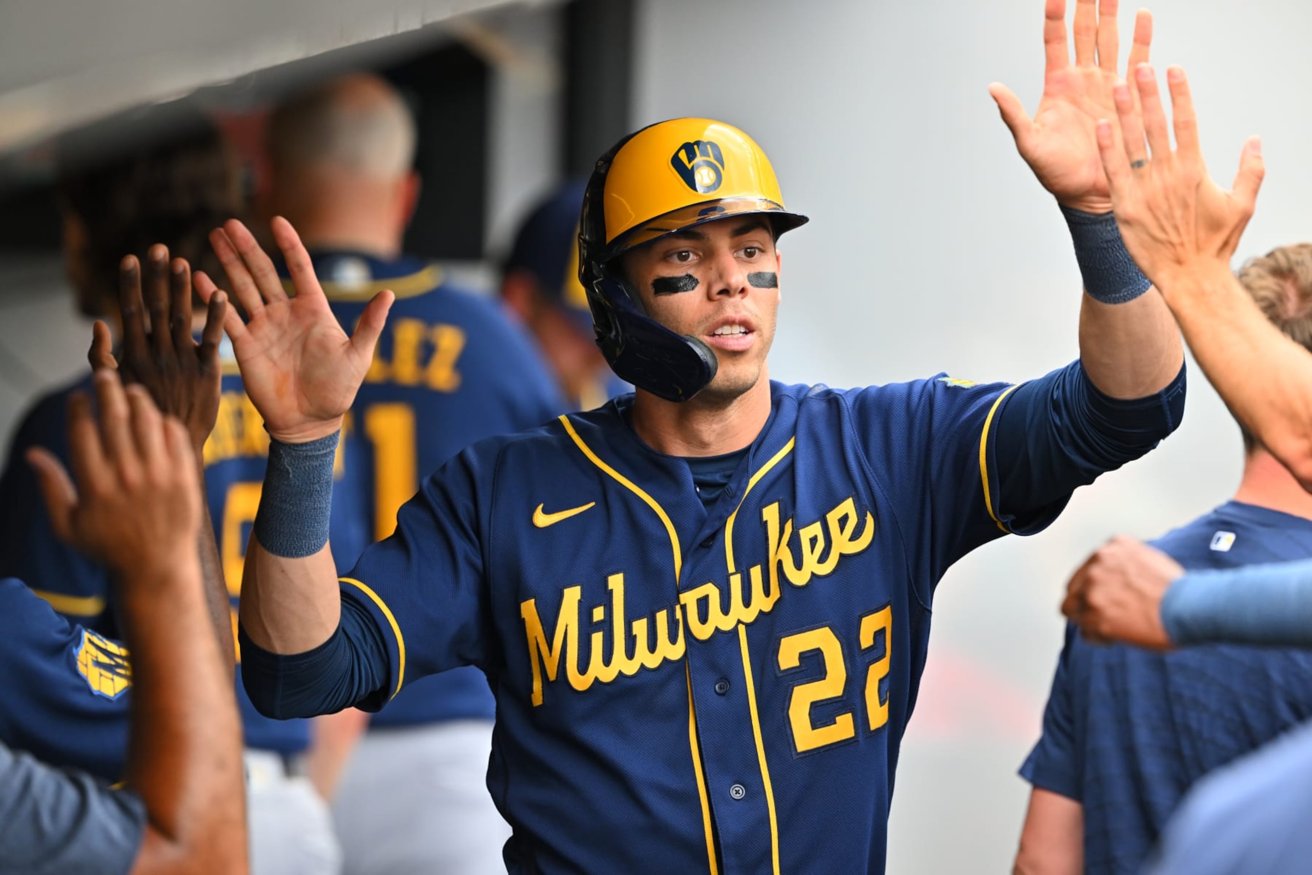CLEVELAND, OHIO - JUNE 25: Christian Yelich #22 of the Milwaukee Brewers celebrates after scoring during the third inning against the Cleveland Guardians at Progressive Field on June 25, 2023 in Cleveland, Ohio. (Photo by Jason Miller/Getty Images)