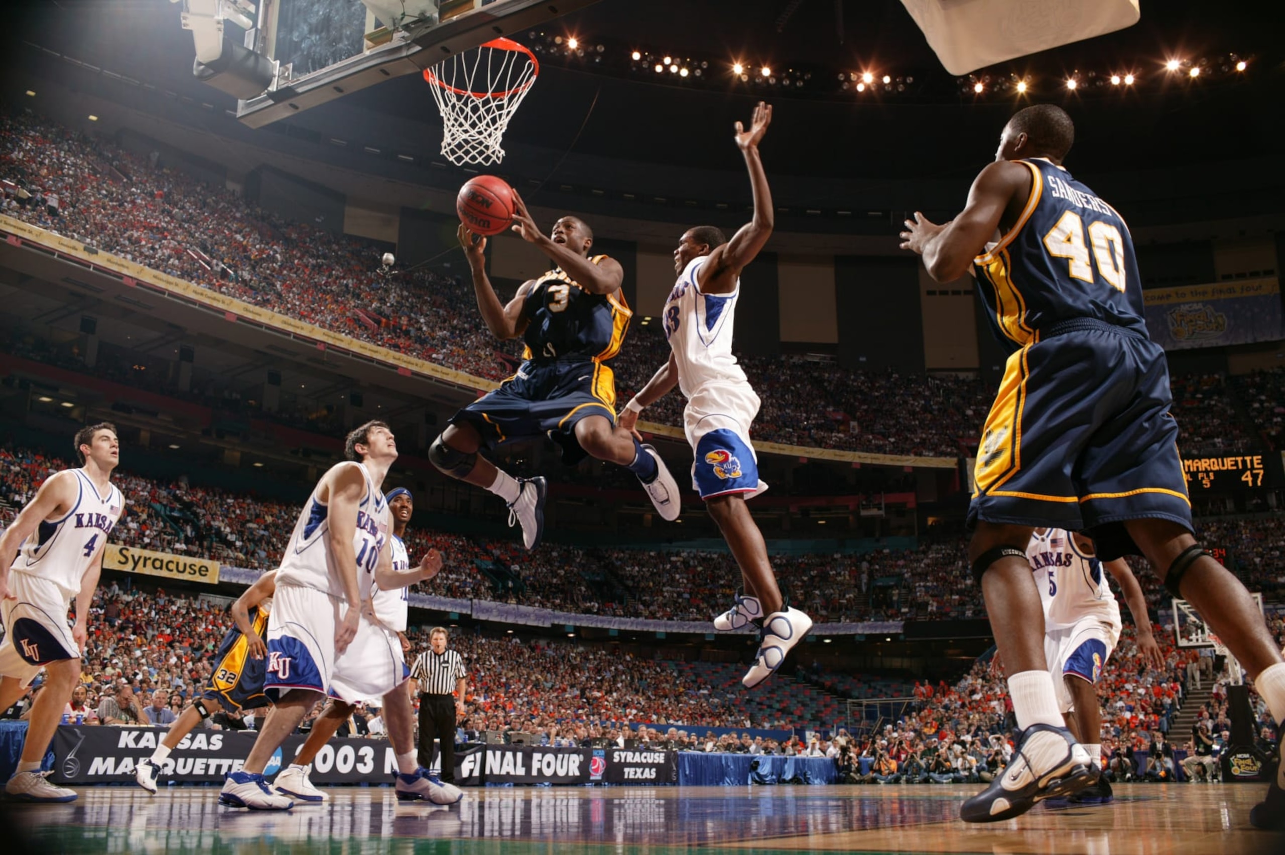 College Basketball: NCAA Final Four: Marquette Dwyane Wade (3) in action vs Kansas Bryant Nash (33) at Louisiana Superdome.
New Orleans, LA 4/5/2003
CREDIT: John Biever (Photo by John Biever /Sports Illustrated via Getty Images)
(Set Number: X68051 TK2 ) College Basketball: NCAA Final Four: Marquette Dwyane Wade (3) in action vs Kansas Bryant Nash (33) at Louisiana Superdome.
New Orleans, LA 4/5/2003
CREDIT: John Biever (Photo by John Biever /Sports Illustrated via Getty Images)
(Set Number: X68051 TK2 )