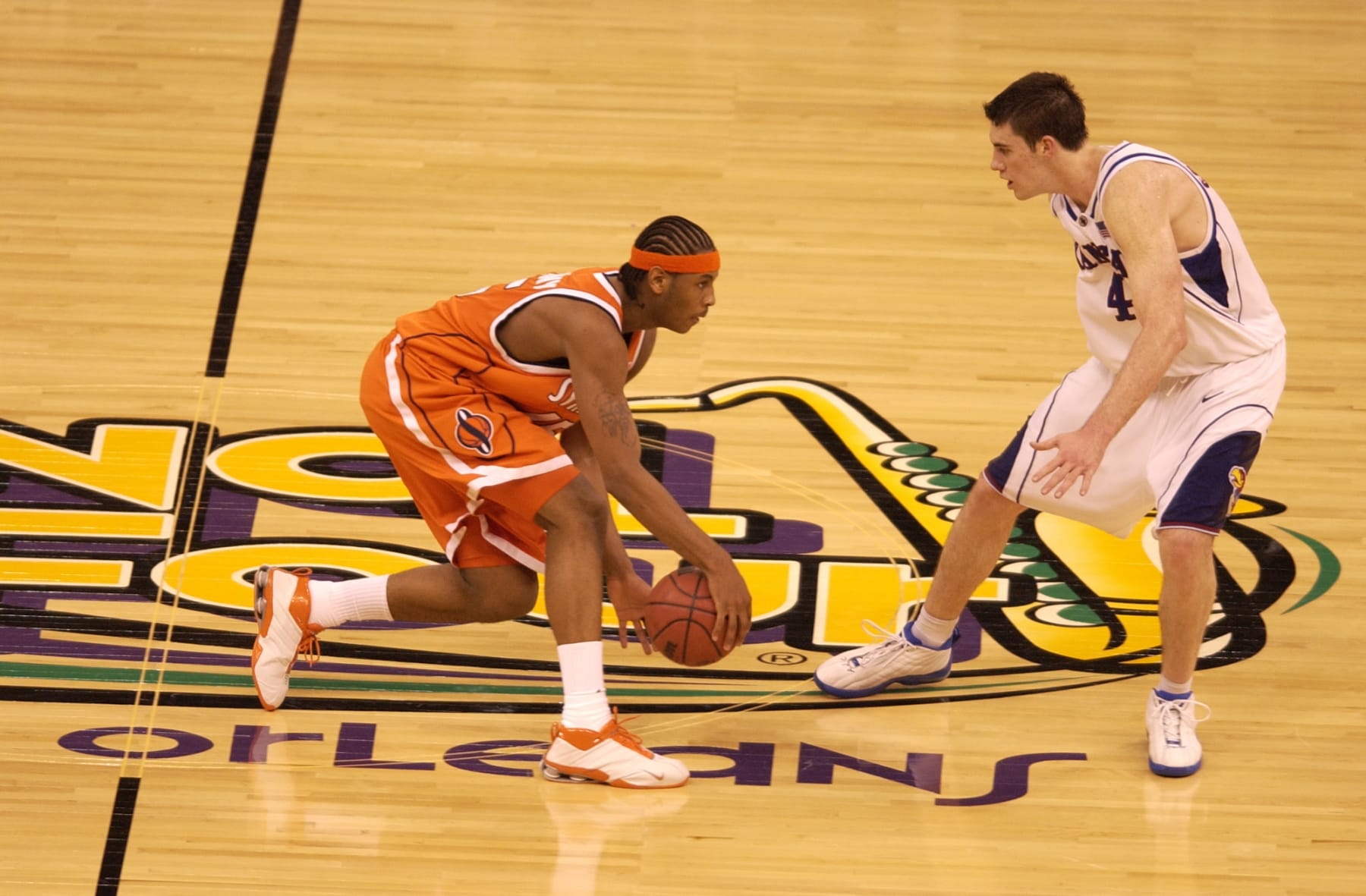 7 April 2003: Syracuse forward Carmelo Anthony (15) dribbles the ball upcourt against Kansas forward Nick Collison (4) during the Men's Division I Final Four Championships held at the Louisiana Superdome in New Orleans, LA. Syracuse University went on to defeat Kansas University 81-78 for the championship title. Photo by: Brett Wilhelm/NCAA Photos via Getty Images