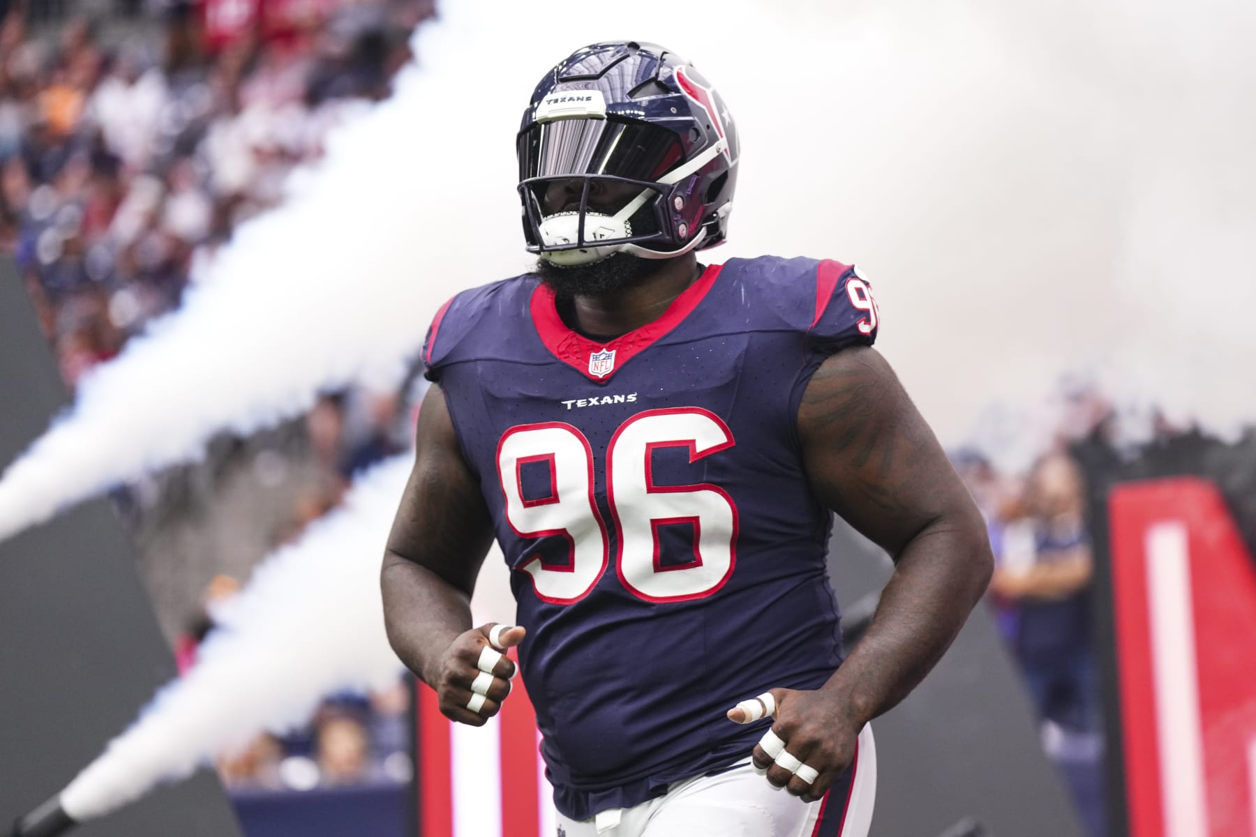 HOUSTON, TX - NOVEMBER 05: Maliek Collins #96 of the Houston Texans runs out of the tunnel prior to an NFL football game against the Tampa Bay Buccaneers at NRG Stadium on November 5, 2023 in Houston, Texas. (Photo by Cooper Neill/Getty Images)
