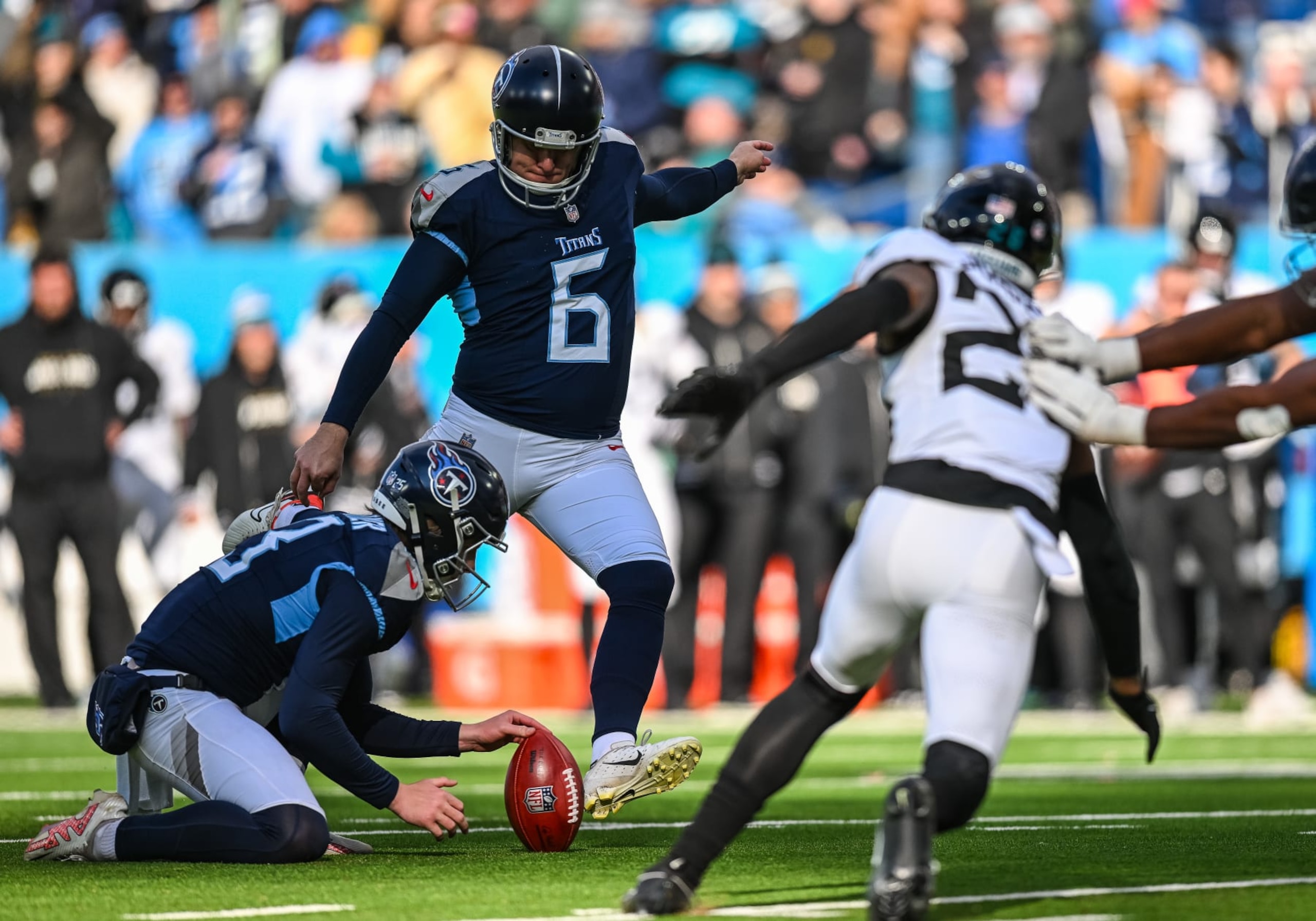 NASHVILLE, TN - JANUARY 07: Tennessee Titans place kicker Nick Folk (6) kicks an extra point during the NFL game between the Tennessee Titans and the Jacksonville Jaguars on January 7, 2024, at Nissan Stadium in Nashville, TN. (Photo by Bryan Lynn/Icon Sportswire via Getty Images)