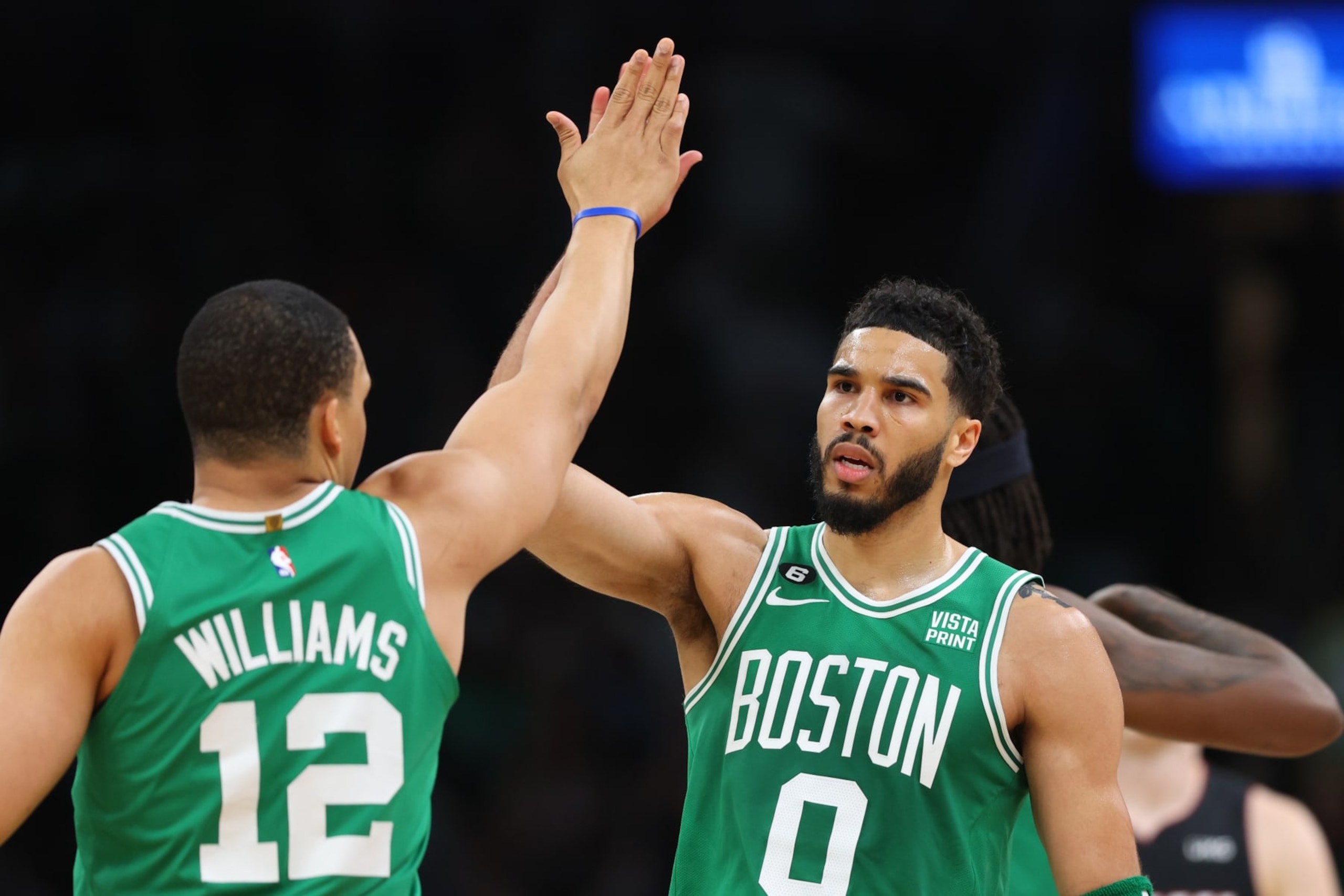 BOSTON, MASSACHUSETTS - MAY 25: Jayson Tatum #0 high fives Grant Williams #12 of the Boston Celtics during the first quarter against the Miami Heat in game five of the Eastern Conference Finals at TD Garden on May 25, 2023 in Boston, Massachusetts. NOTE TO USER: User expressly acknowledges and agrees that, by downloading and or using this photograph, User is consenting to the terms and conditions of the Getty Images License Agreement. (Photo by Maddie Meyer/Getty Images)