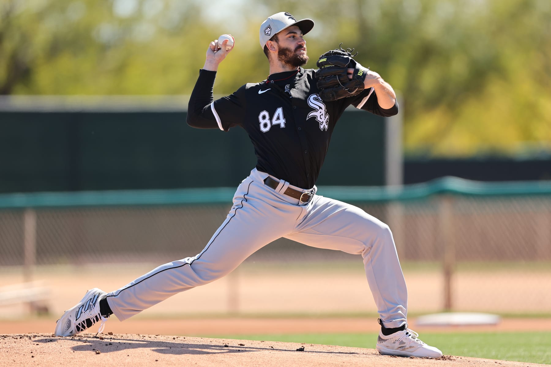 GLENDALE, ARIZONA - FEBRUARY 21: Dylan Cease #84 of the Chicago White Sox delivers a pitch during a live batting practice session during a spring training workout at Camelback Ranch on February 21, 2024 in Glendale, Arizona. (Photo by Michael Reaves/Getty Images)