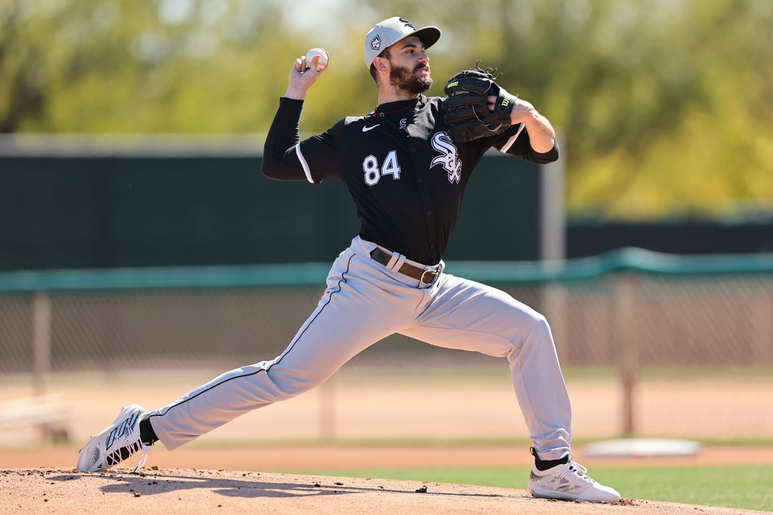 GLENDALE, ARIZONA - FEBRUARY 21: Dylan Cease #84 of the Chicago White Sox delivers a pitch during a live batting practice session during a spring training workout at Camelback Ranch on February 21, 2024 in Glendale, Arizona. (Photo by Michael Reaves/Getty Images)