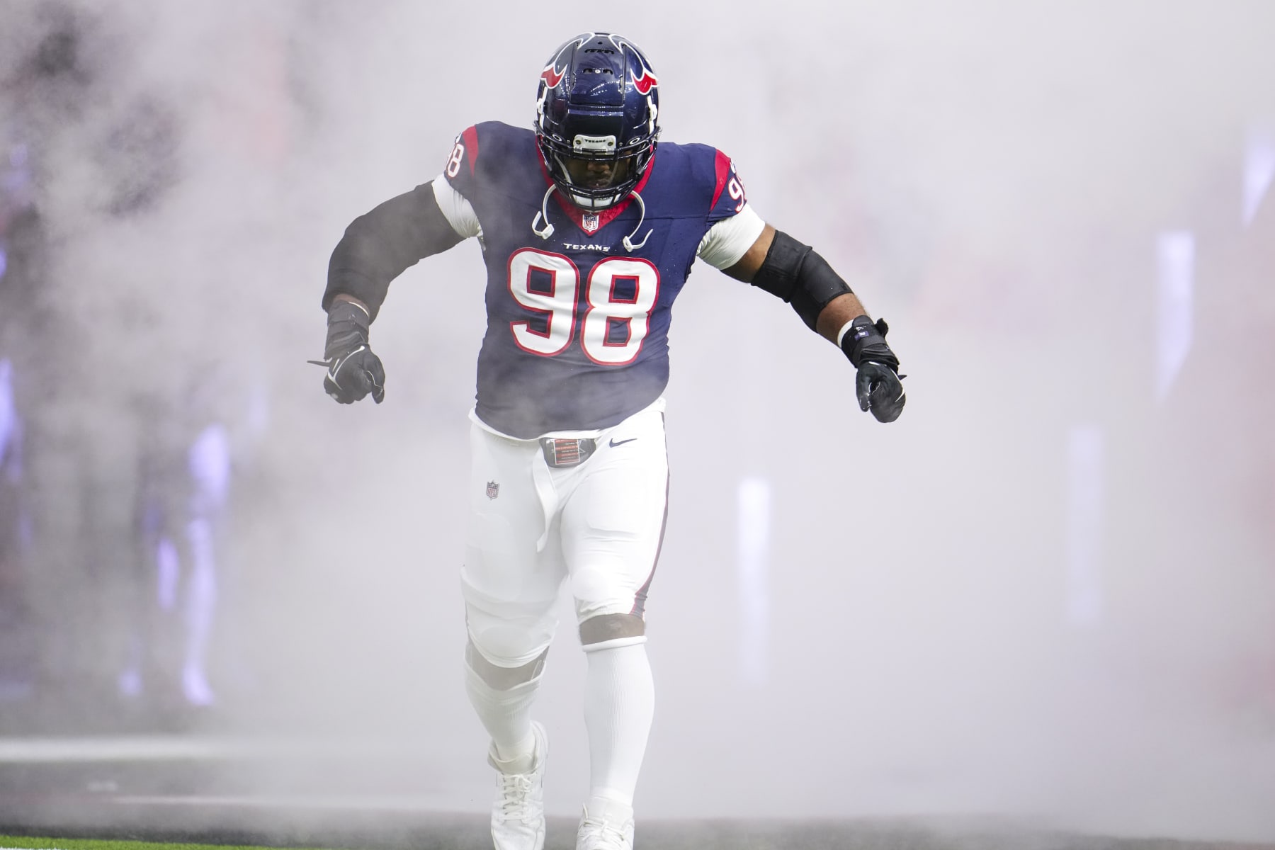 HOUSTON, TX - DECEMBER 24: Sheldon Rankins #98 of the Houston Texans runs out of the tunnel prior to an NFL football game against the Cleveland Browns at NRG Stadium on December 24, 2023 in Houston, Texas. (Photo by Cooper Neill/Getty Images)