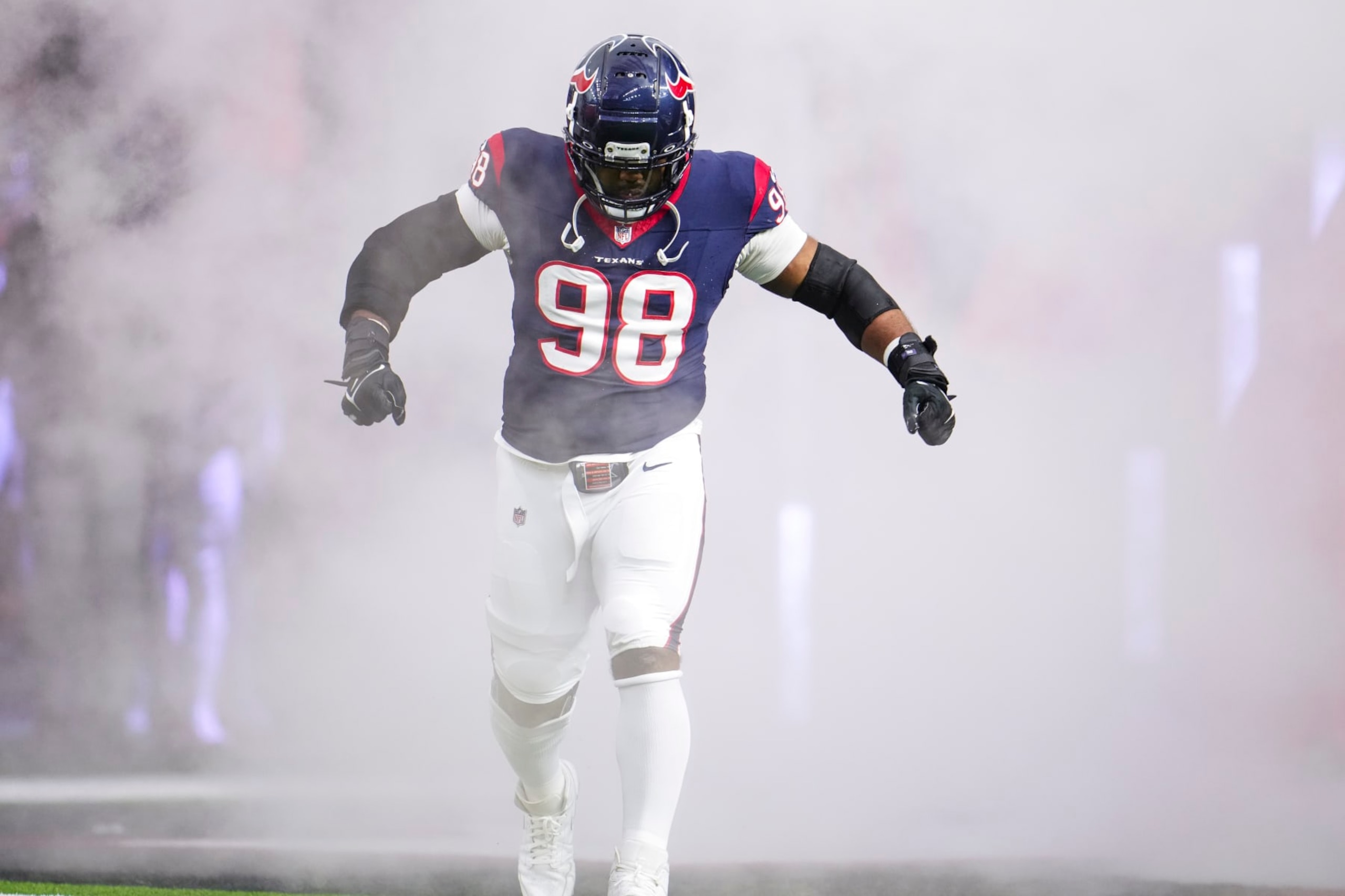 HOUSTON, TX - DECEMBER 24: Sheldon Rankins #98 of the Houston Texans runs out of the tunnel prior to an NFL football game against the Cleveland Browns at NRG Stadium on December 24, 2023 in Houston, Texas. (Photo by Cooper Neill/Getty Images)