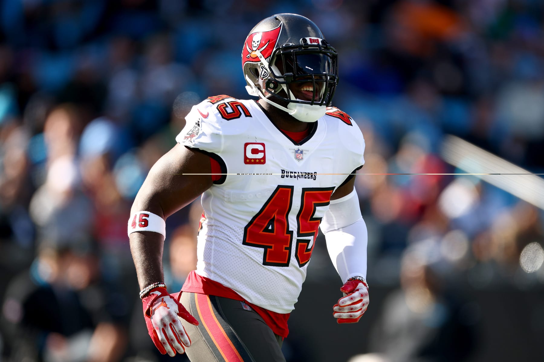 CHARLOTTE, NORTH CAROLINA - JANUARY 07: Devin White #45 of the Tampa Bay Buccaneers reacts to a tackle during the first quarter against the Carolina Panthers at Bank of America Stadium on January 07, 2024 in Charlotte, North Carolina. (Photo by Jared C. Tilton/Getty Images)