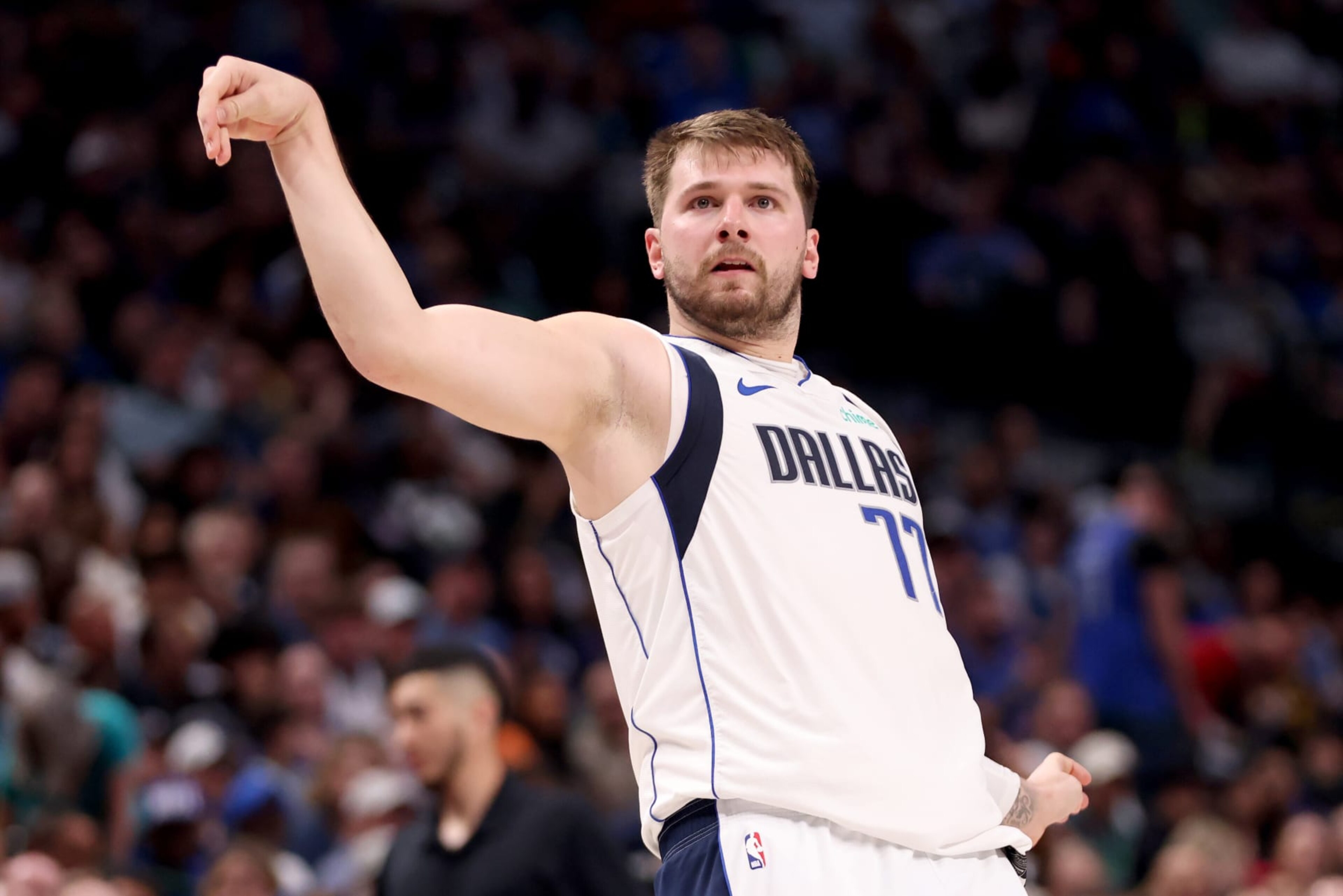 DALLAS, TEXAS - MARCH 13: Luka Doncic #77 of the Dallas Mavericks watches a shot against the Golden State Warriors in the first half at American Airlines Center on March 13, 2024 in Dallas, Texas. NOTE TO USER: User expressly acknowledges and agrees that, by downloading and or using this photograph, User is consenting to the terms and conditions of the Getty Images License Agreement. (Photo by Tim Heitman/Getty Images)