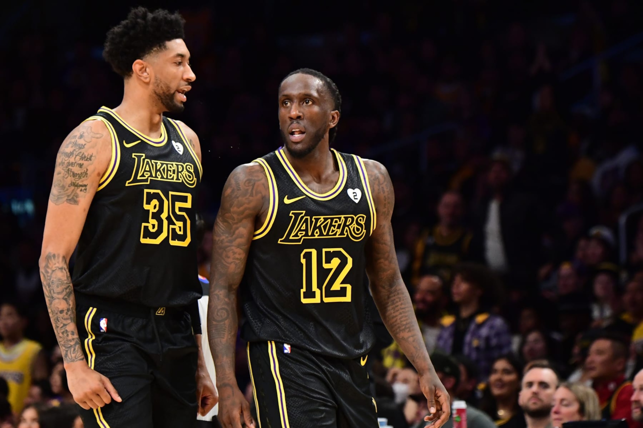 LOS ANGELES, CA - FEBRUARY 8: Taurean Prince #12  talks to Christian Wood #35 of the Los Angeles Lakers during the game against the Denver Nuggets on February 8, 2024 at Crypto.Com Arena in Los Angeles, California. NOTE TO USER: User expressly acknowledges and agrees that, by downloading and/or using this Photograph, user is consenting to the terms and conditions of the Getty Images License Agreement. Mandatory Copyright Notice: Copyright 2024 NBAE (Photo by Adam Pantozzi/NBAE via Getty Images)