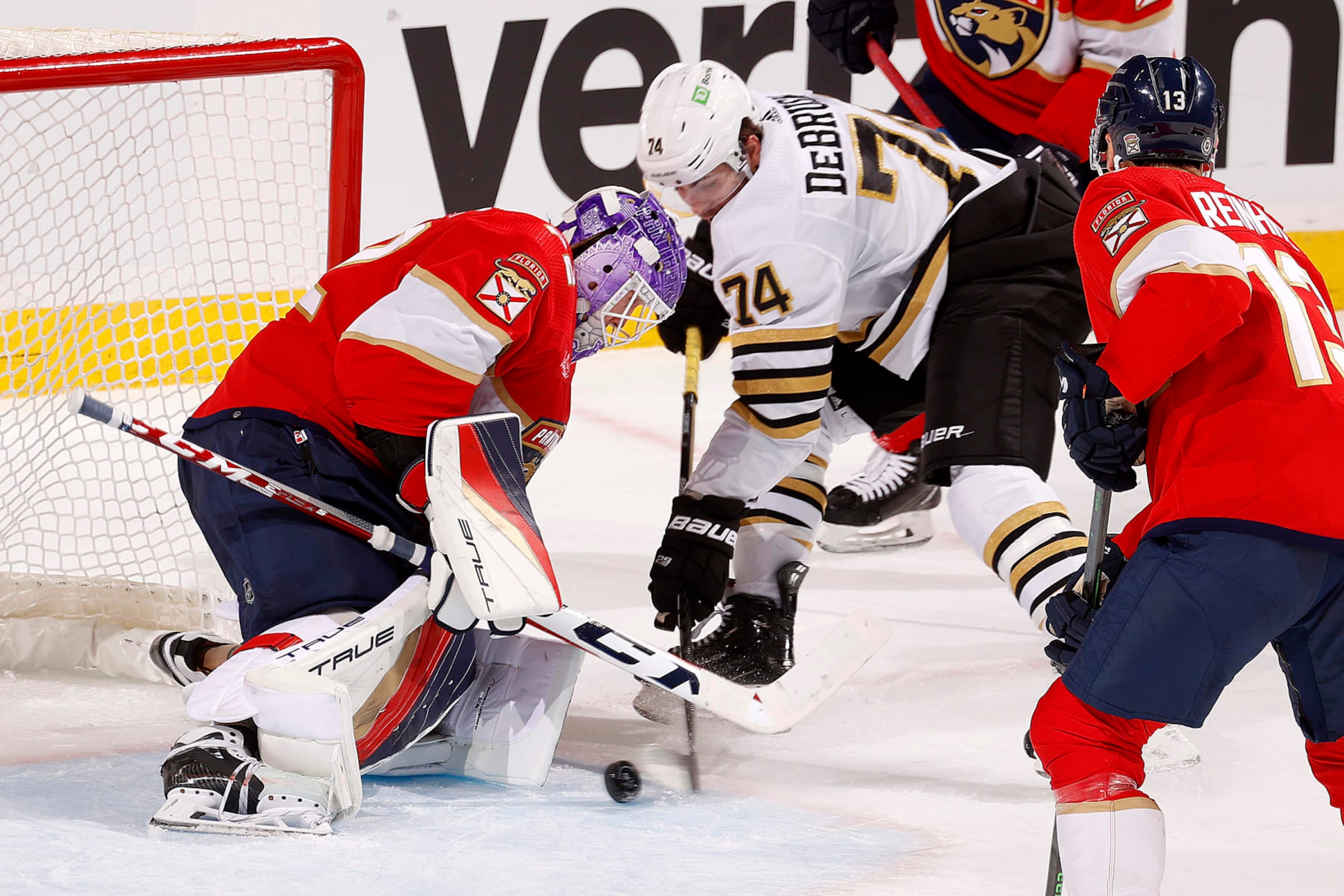 SUNRISE, FLORIDA - NOVEMBER 22: Goaltender Sergei Bobrovsky #72 of the Florida Panthers defends the net against Jake DeBrusk #74 of the Boston Bruins at the Amerant Bank Arena on November 22, 2023 in Sunrise, Florida. (Photo by Eliot J. Schechter/NHLI via Getty Images)