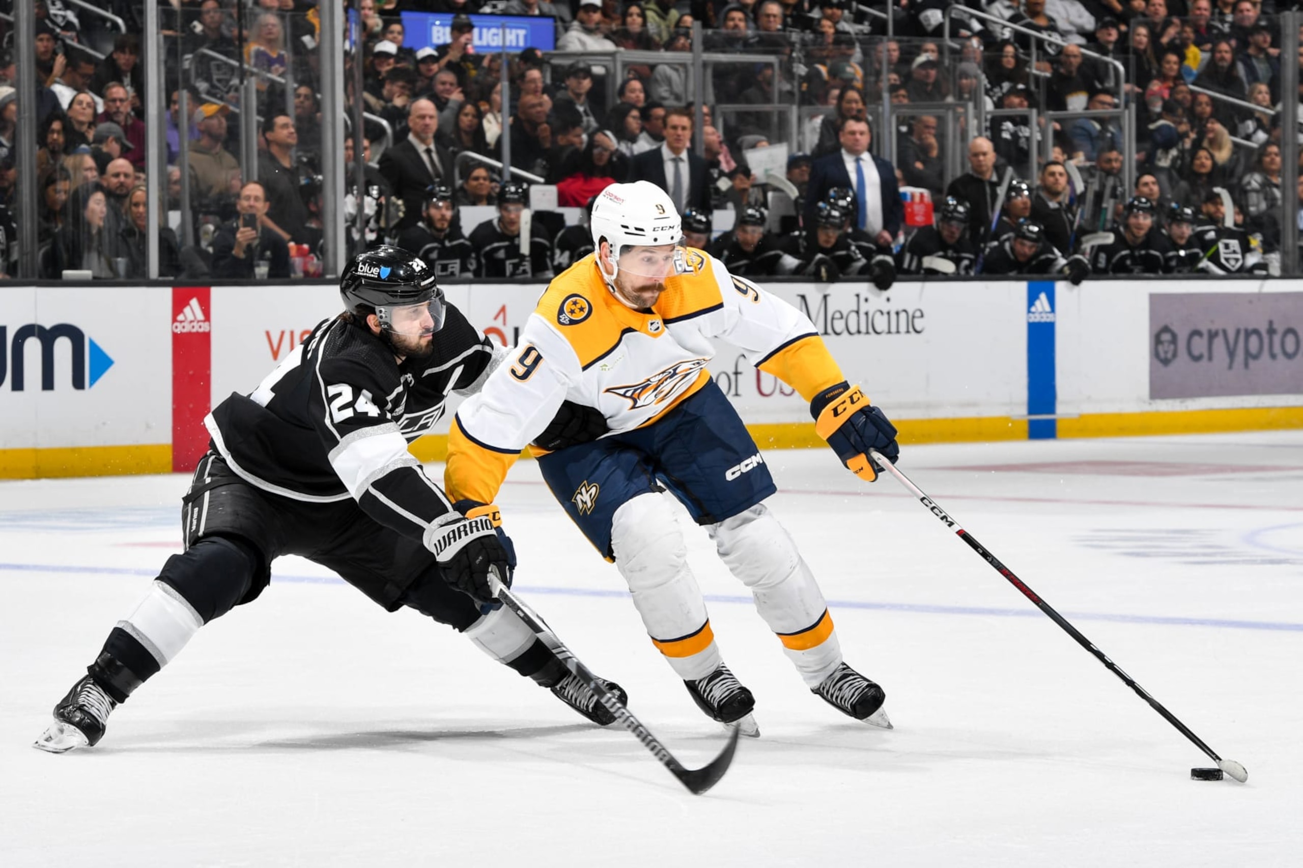 LOS ANGELES, CA - FEBRUARY 22: Phillip Danault #24 of the Los Angeles Kings and Filip Forsberg #9 of the Nashville Predators battle for the puck during the second period at Crypto.com Arena on February 22, 2024 in Los Angeles, California. (Photo by Juan Ocampo/NHLI via Getty Images)
