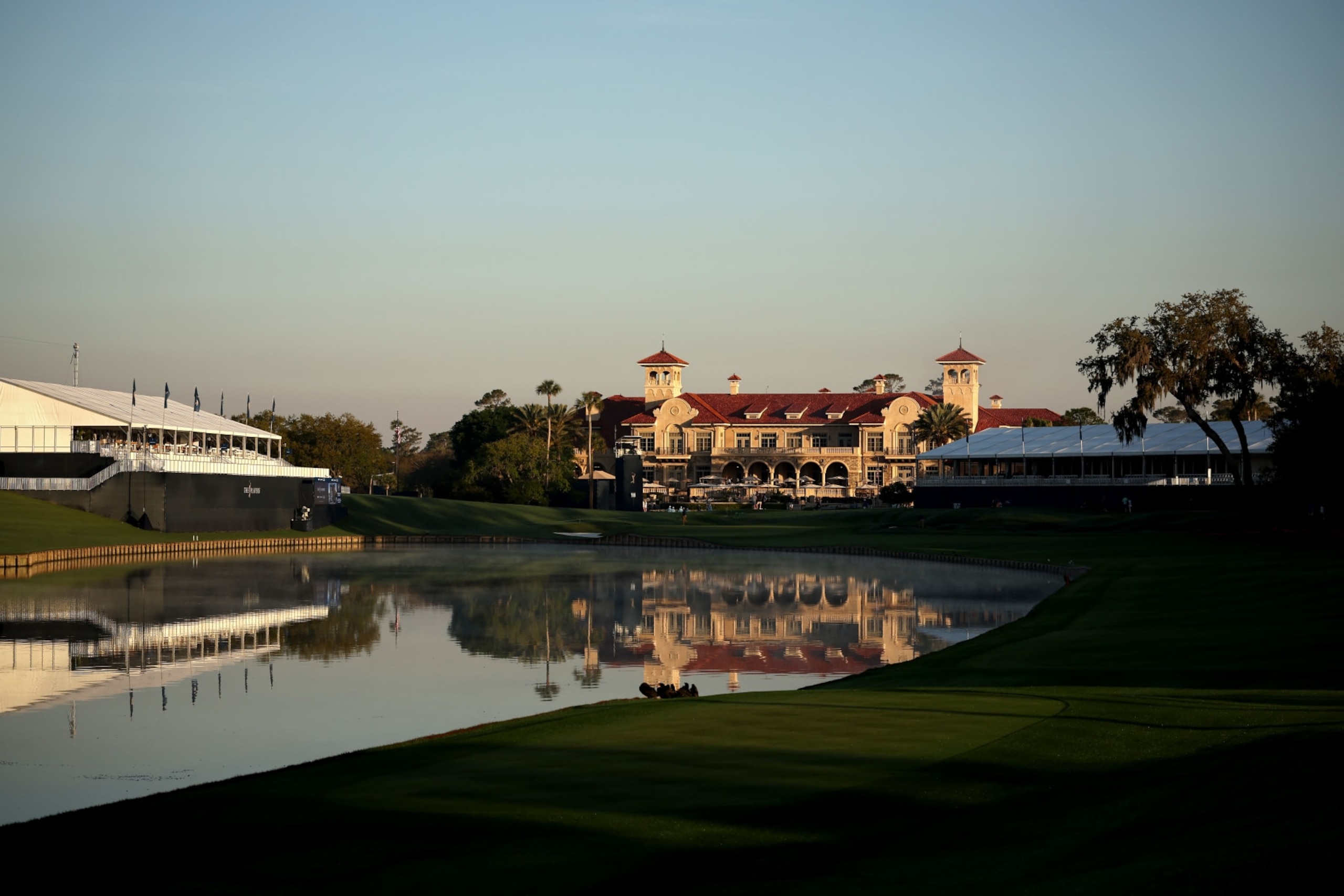 PONTE VEDRA BEACH, FLORIDA - MARCH 14: A general view of the 18th hole and the clubhouse during the first round of THE PLAYERS Championship on the Stadium Course at TPC Sawgrass on March 14, 2024 in Ponte Vedra Beach, Florida. (Photo by Jared C. Tilton/Getty Images)