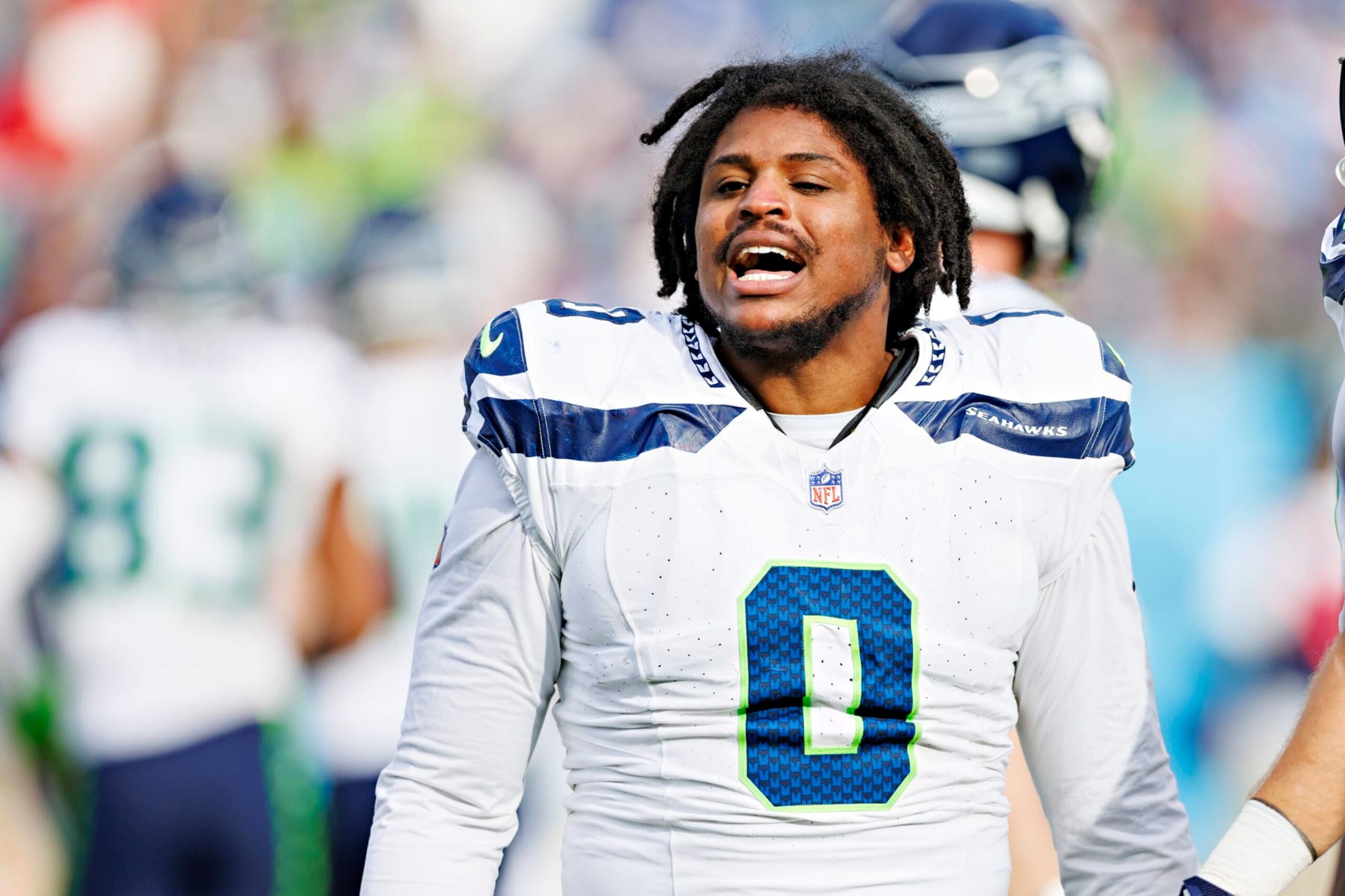 NASHVILLE, TENNESSEE - DECEMBER 24: Devin Bush #0 of the Seattle Seahawks has a conversation with the Titans bench during the game against the Tennessee Titans at Nissan Stadium on December 24, 2023 in Nashville, Tennessee. The Seahawks defeated the Titans 20-17.  (Photo by Wesley Hitt/Getty Images)