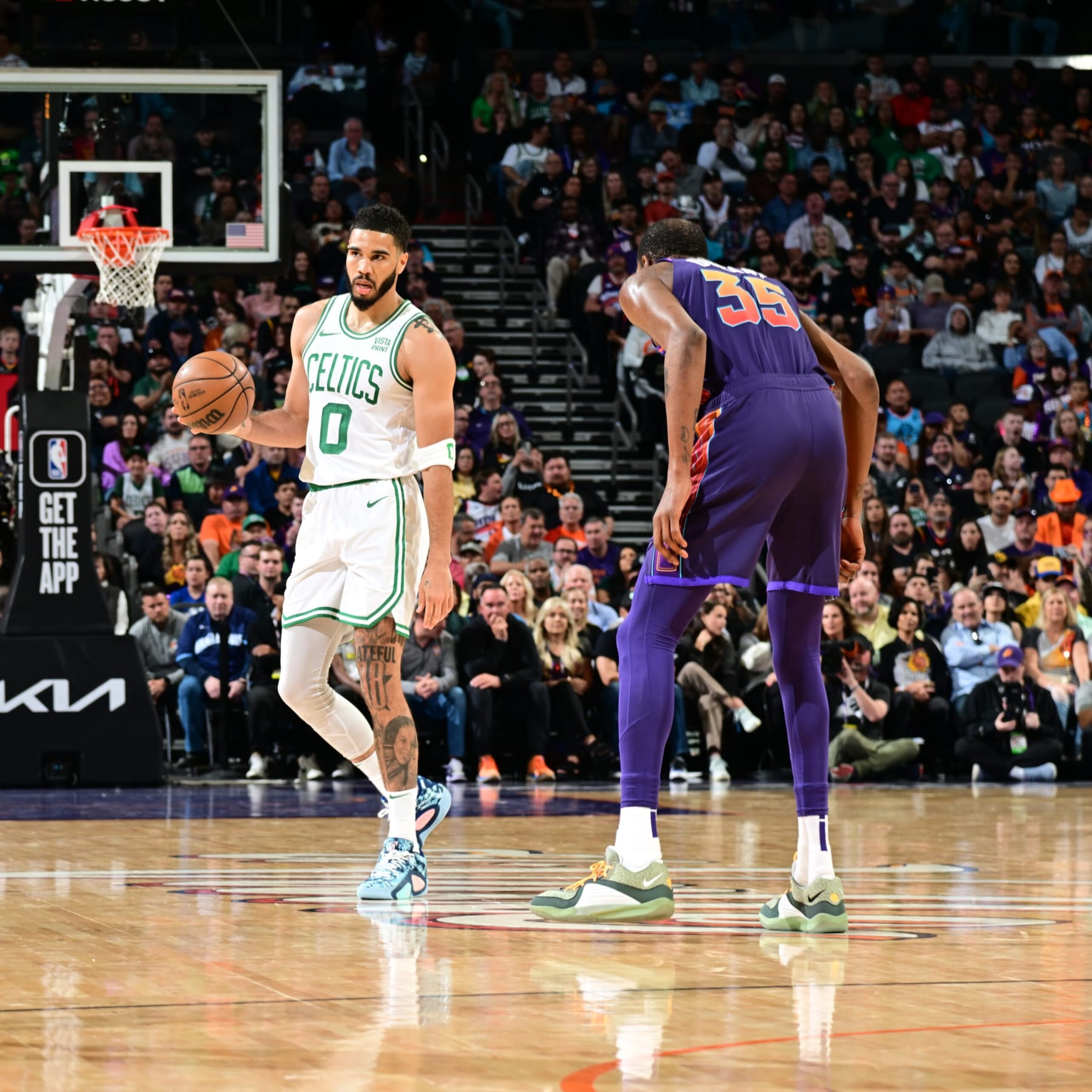 PHOENIX, AZ - MARCH  9: Jayson Tatum #0 of the Boston Celtics handles the ball against Kevin Durant #35 of the Phoenix Suns during the game on March 9, 2024 at Footprint Center in Phoenix, Arizona. NOTE TO USER: User expressly acknowledges and agrees that, by downloading and or using this photograph, user is consenting to the terms and conditions of the Getty Images License Agreement. Mandatory Copyright Notice: Copyright 2024 NBAE (Photo by Kate Frese/NBAE via Getty Images)