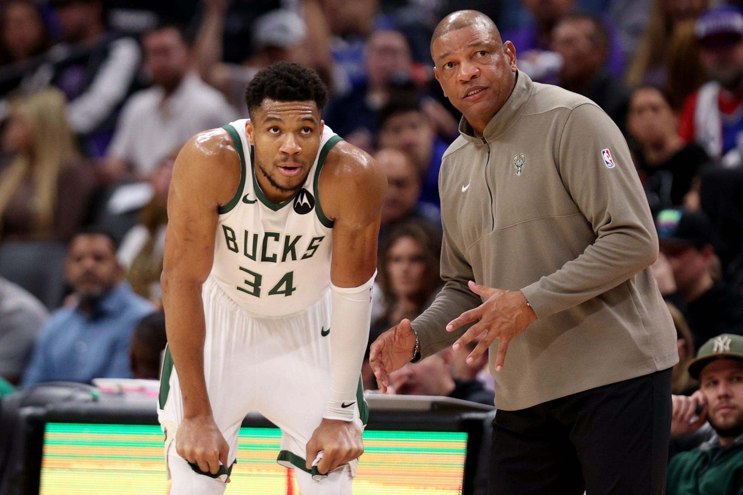 SACRAMENTO, CALIFORNIA - MARCH 12: Giannis Antetokounmpo #34 talks to Milwaukee Bucks head coach Doc Rivers during their game against the Sacramento Kings at Golden 1 Center on March 12, 2024 in Sacramento, California. NOTE TO USER: User expressly acknowledges and agrees that, by downloading and or using this photograph, User is consenting to the terms and conditions of the Getty Images License Agreement.  (Photo by Ezra Shaw/Getty Images)