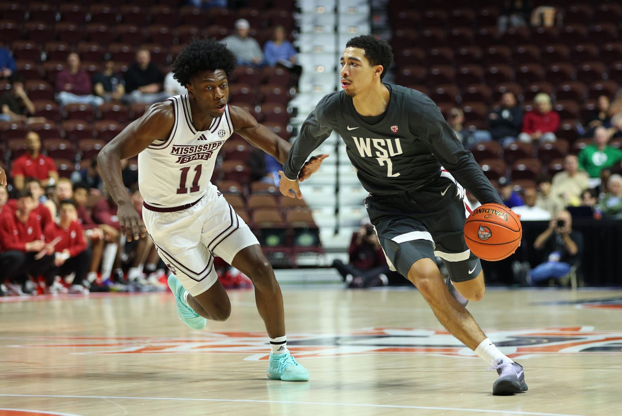 UNCASVILLE, CT - NOVEMBER 18: Washington State Cougars guard Myles Rice (2) drives past Mississippi State Bulldogs guard Trey Fort (11) during the Basket Hall of Fame Tip Off game between Mississippi State Bulldogs and Washington State Cougars on November 18, 2023, at Mohegan Sun Arena in Uncasville, CT. (Photo by M. Anthony Nesmith/Icon Sportswire via Getty Images)