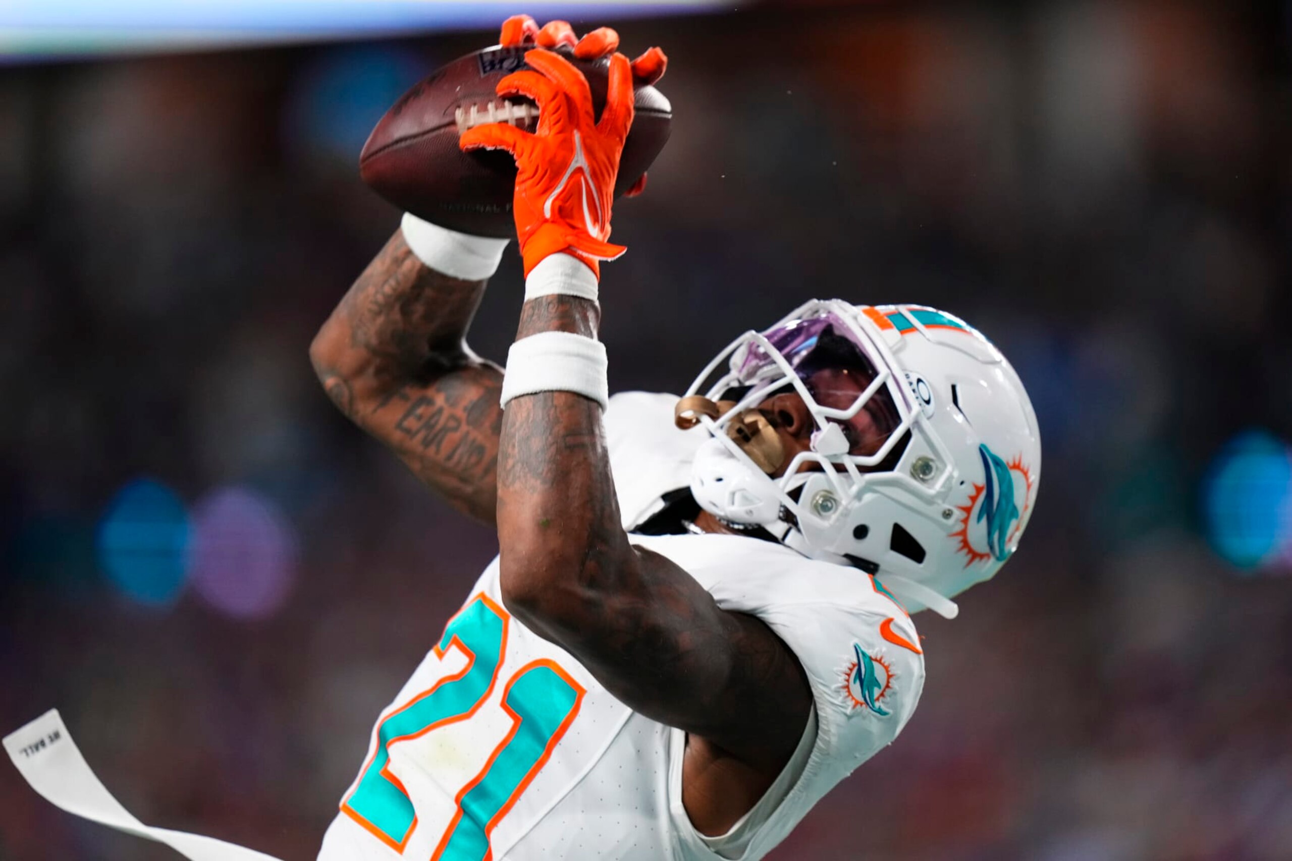 MIAMI GARDENS, FLORIDA - JANUARY 07: DeShon Elliott #21 of the Miami Dolphins intercepts a pass during the first half against the Buffalo Bills at Hard Rock Stadium on January 07, 2024 in Miami Gardens, Florida. (Photo by Rich Storry/Getty Images)