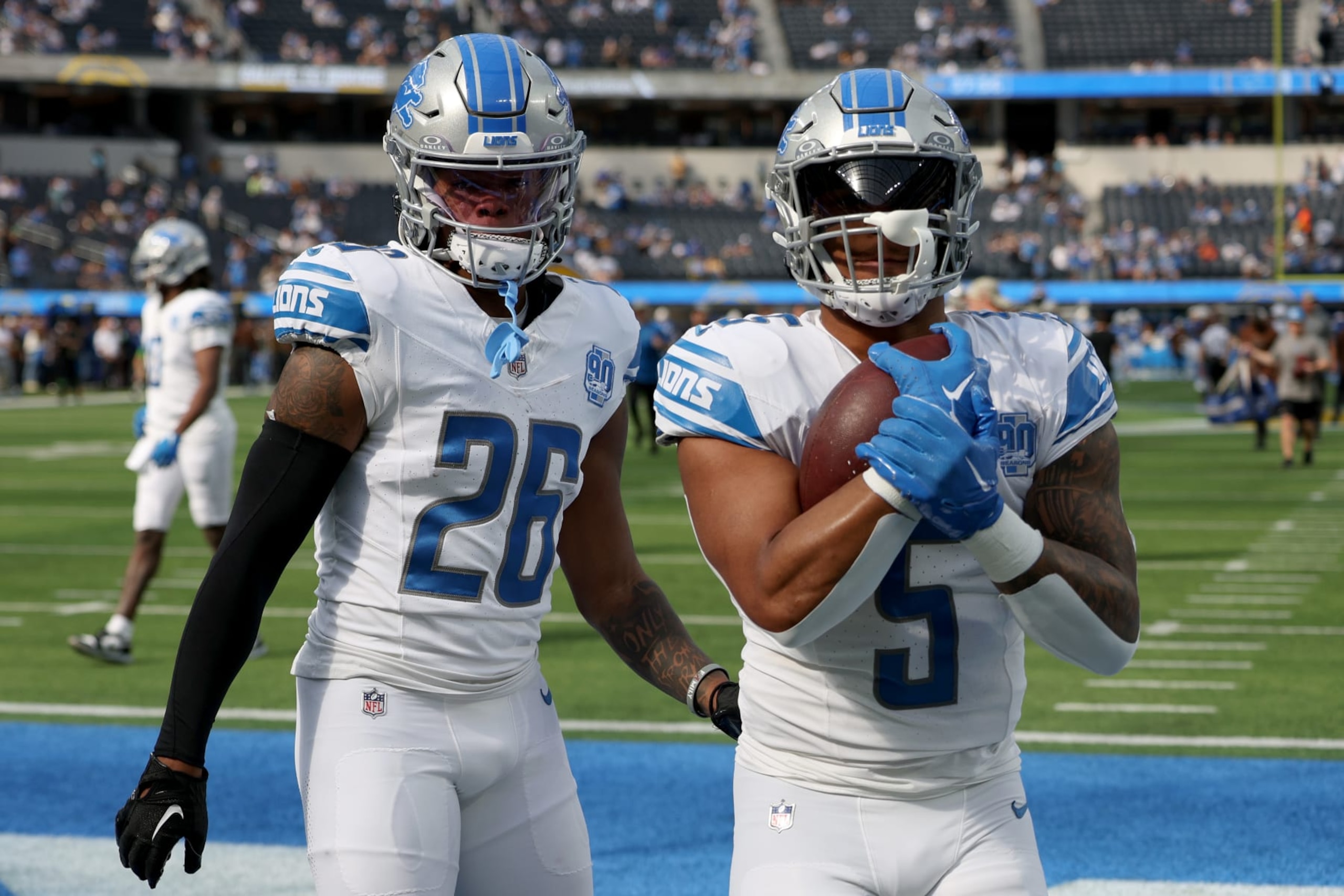 Lions running backs Jahmyr Gibbs (26) and David Montgomery (5)