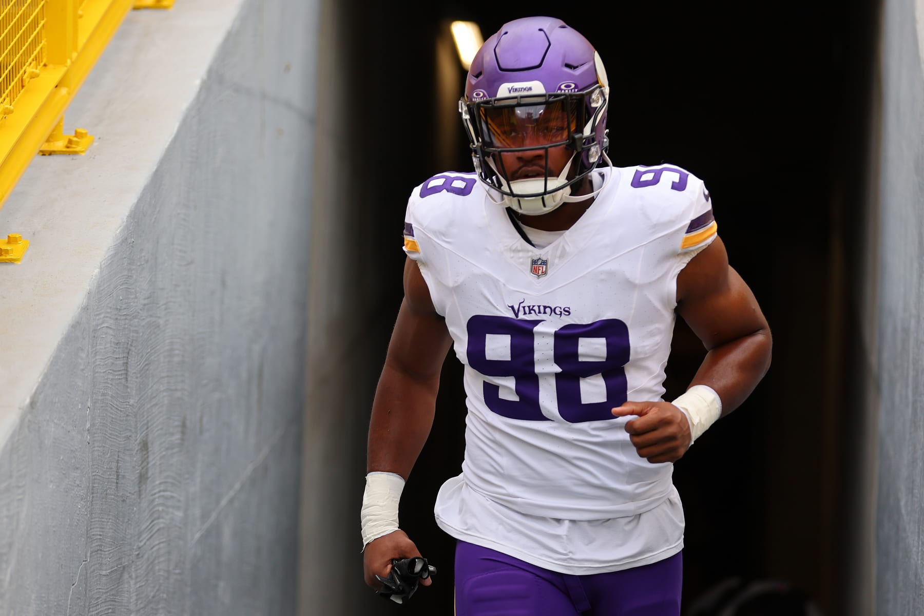 GREEN BAY, WISCONSIN - OCTOBER 29: D.J. Wonnum #98 of the Minnesota Vikings takes the field prior to the game against the Green Bay Packers at Lambeau Field on October 29, 2023 in Green Bay, Wisconsin. (Photo by Michael Reaves/Getty Images)