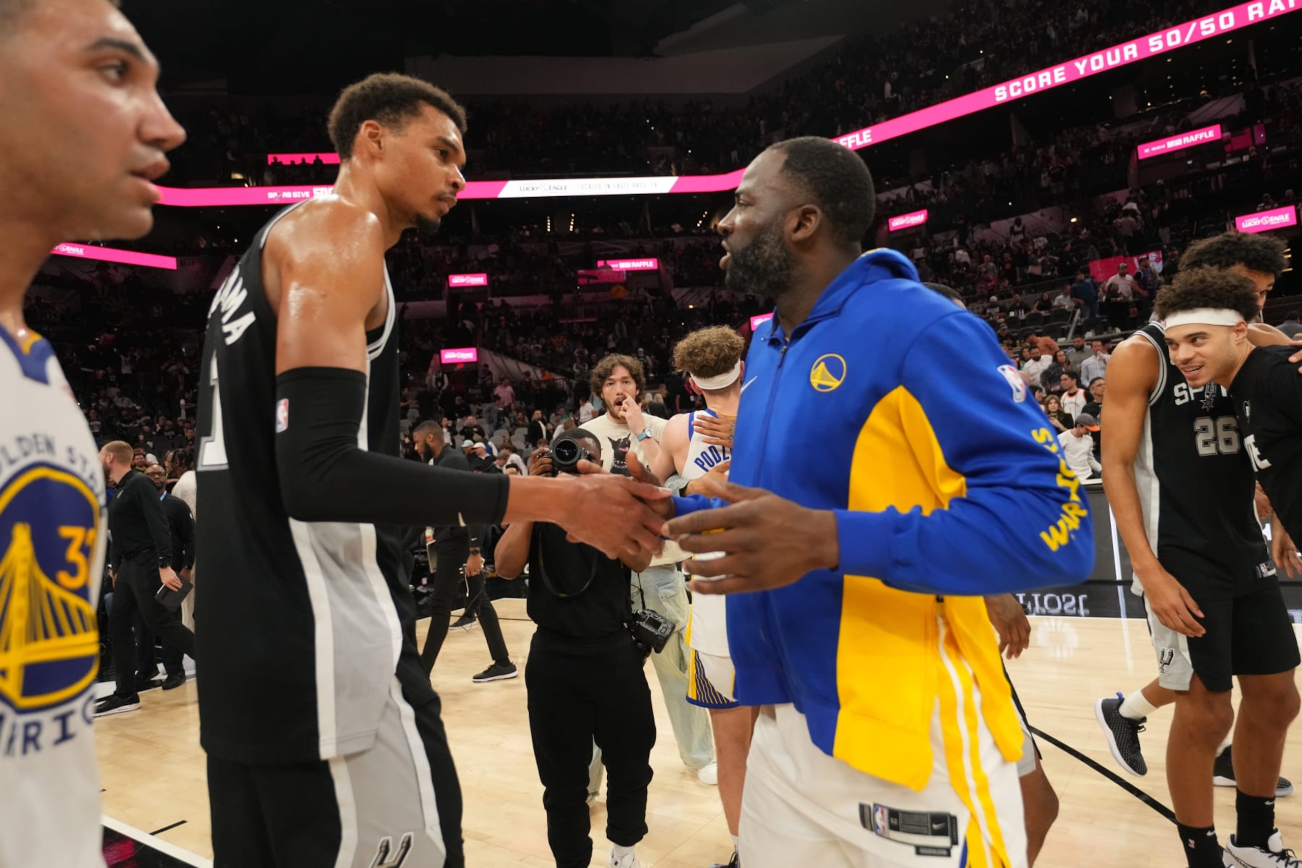 SAN ANTONIO, TX - MARCH 11: Victor Wembanyama #1 of the San Antonio Spurs and Draymond Green #23 of the Golden State Warriors shake hands after the game on March 11, 2024 at the AT&T Center in San Antonio, Texas. NOTE TO USER: User expressly acknowledges and agrees that, by downloading and or using this photograph, user is consenting to the terms and conditions of the Getty Images License Agreement. Mandatory Copyright Notice: Copyright 2024 NBAE (Photos by Jesse D. Garrabrant/NBAE via Getty Images)