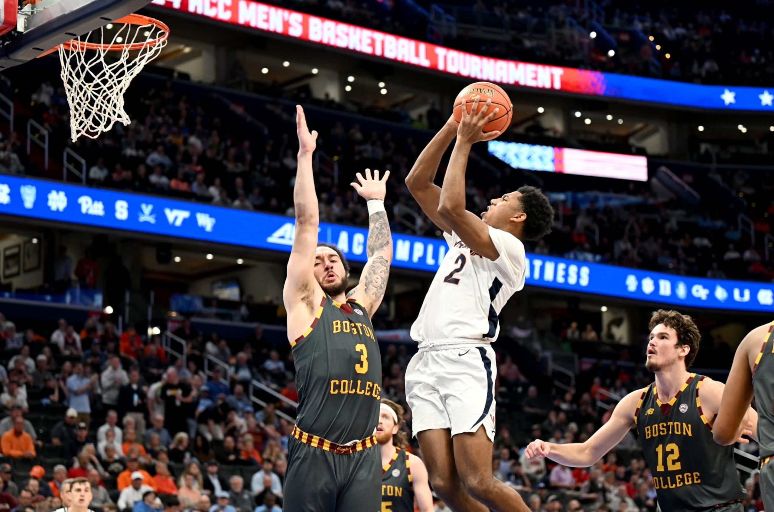 WASHINGTON, DC - MARCH 14: Reece Beekman #2 of the Virginia Cavaliers drives to the basket in the second half against Jaeden Zackery #3 of the Boston College Eagles in the Quarterfinals of the ACC Men's Basketball Tournament  at Capital One Arena on March 14, 2024 in Washington, DC. (Photo by Greg Fiume/Getty Images)