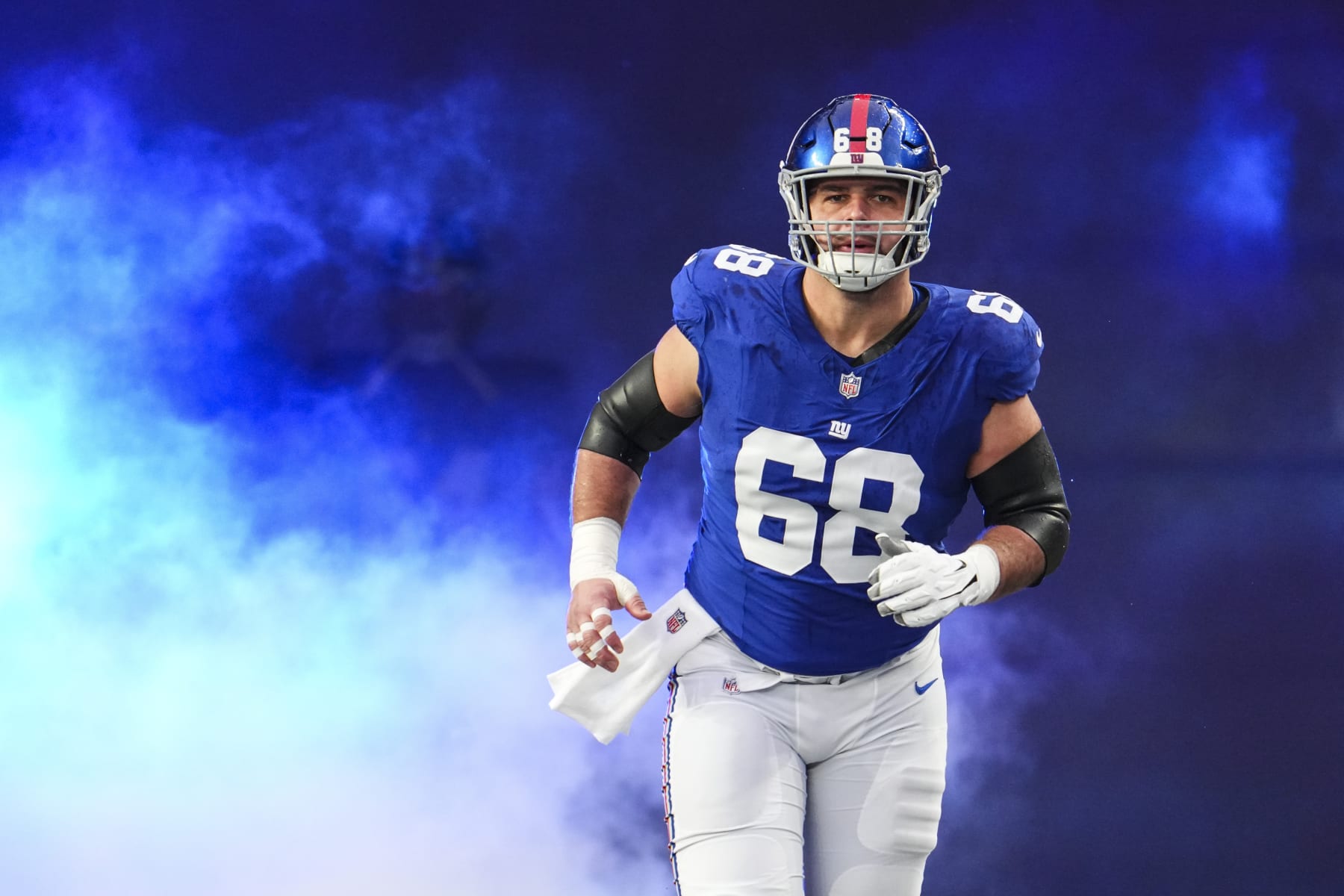 EAST RUTHERFORD, NJ - JANUARY 07: Ben Bredeson #68 of the New York Giants runs out of the tunnel prior to an NFL football game against the Philadelphia Eagles at MetLife Stadium on January 7, 2024 in East Rutherford, New Jersey. (Photo by Cooper Neill/Getty Images)