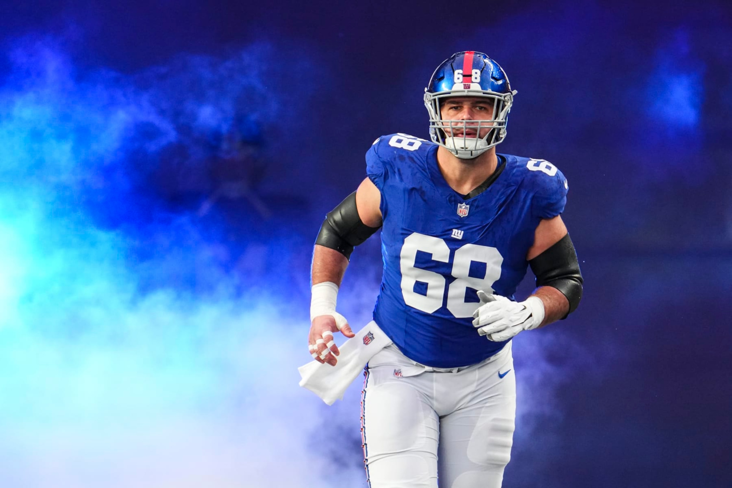 EAST RUTHERFORD, NJ - JANUARY 07: Ben Bredeson #68 of the New York Giants runs out of the tunnel prior to an NFL football game against the Philadelphia Eagles at MetLife Stadium on January 7, 2024 in East Rutherford, New Jersey. (Photo by Cooper Neill/Getty Images)