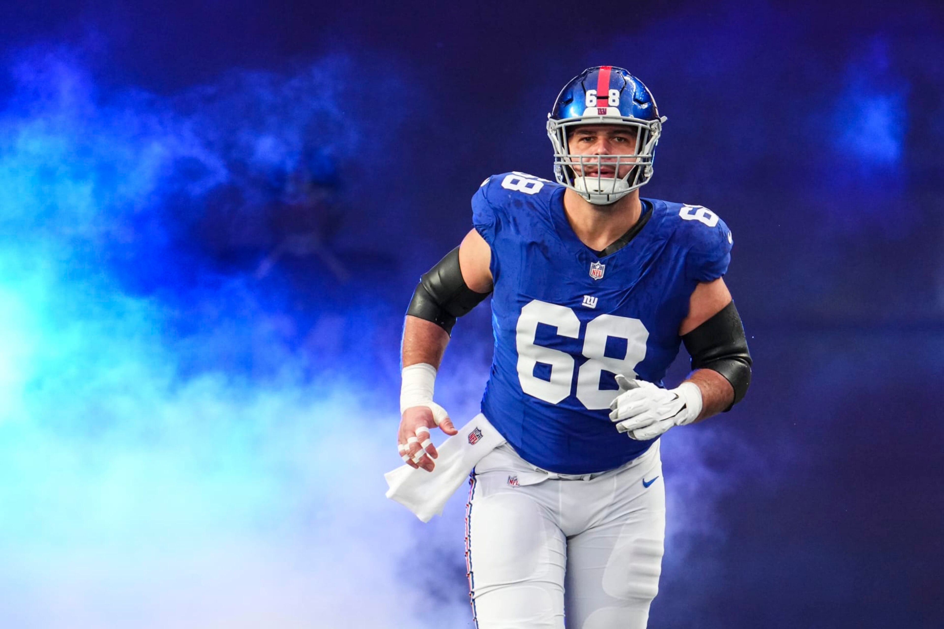 EAST RUTHERFORD, NJ - JANUARY 07: Ben Bredeson #68 of the New York Giants runs out of the tunnel prior to an NFL football game against the Philadelphia Eagles at MetLife Stadium on January 7, 2024 in East Rutherford, New Jersey. (Photo by Cooper Neill/Getty Images)