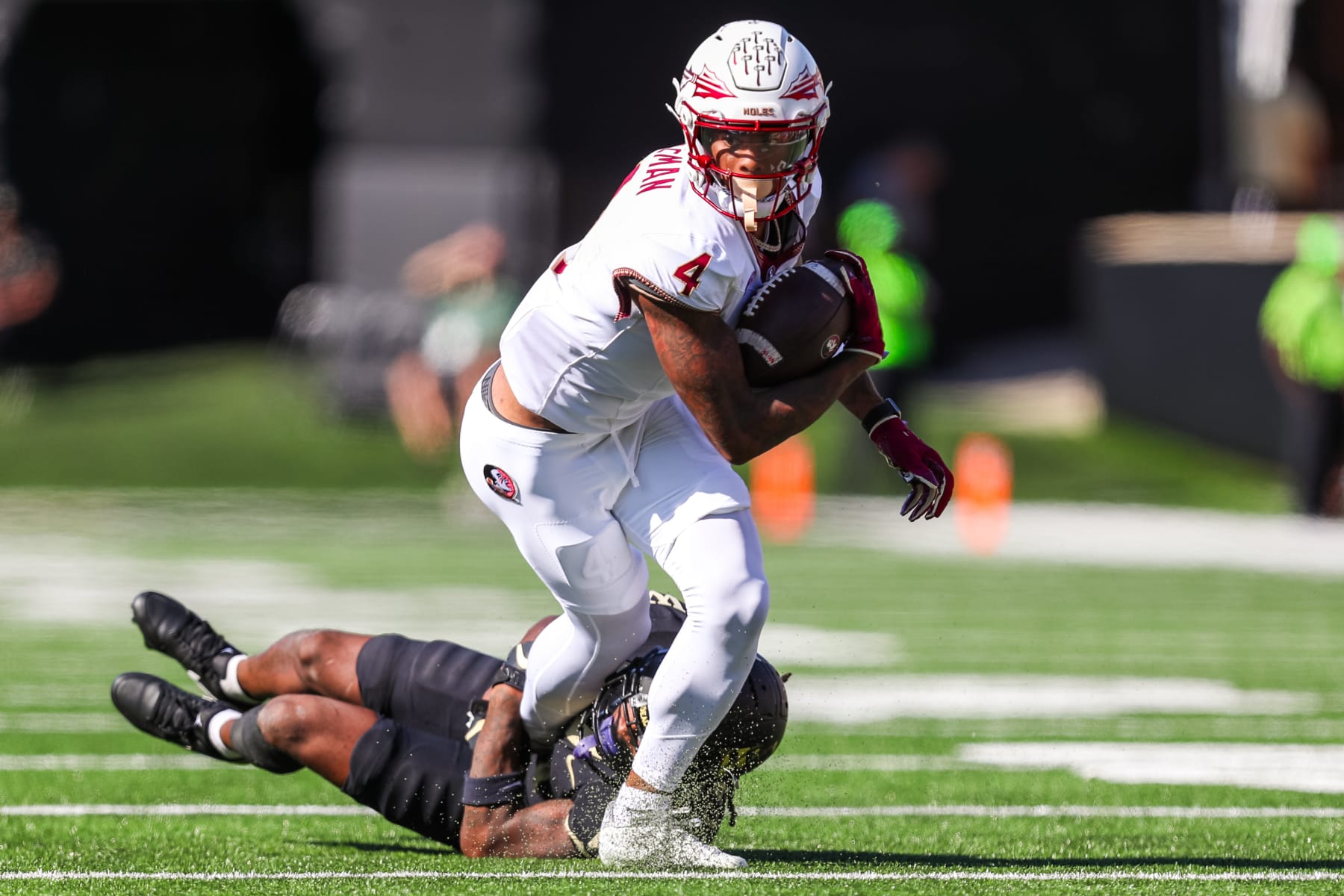 CHARLOTTE, NC - OCTOBER 28: Keon Coleman #4 of the Florida State Seminoles runs the ball after making a catch during a football game against the Wake Forest Demon Deacons at Allegacy Federal Credit Union Stadium in Winston-Salem, North Carolina on Oct 28, 2023. (Photo by David Jensen/Icon Sportswire via Getty Images)