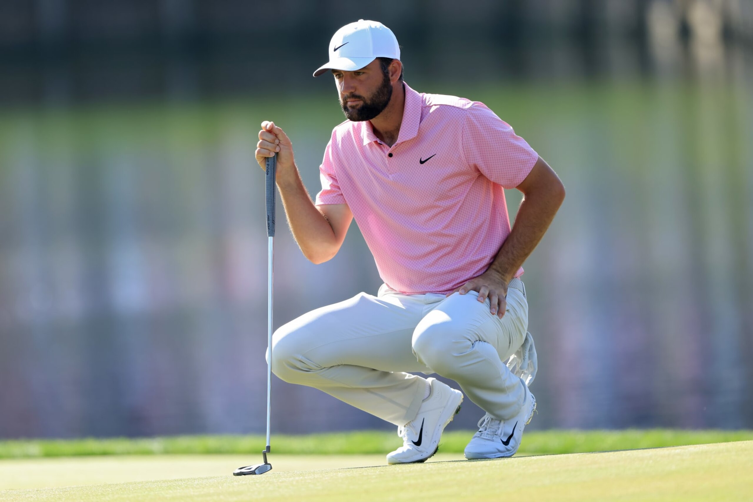 PONTE VEDRA BEACH, FLORIDA - MARCH 15: Scottie Scheffler of the United States lines up a putt on the 17th green during the second round of THE PLAYERS Championship on the Stadium Course at TPC Sawgrass on March 15, 2024 in Ponte Vedra Beach, Florida. (Photo by Sam Greenwood/Getty Images)