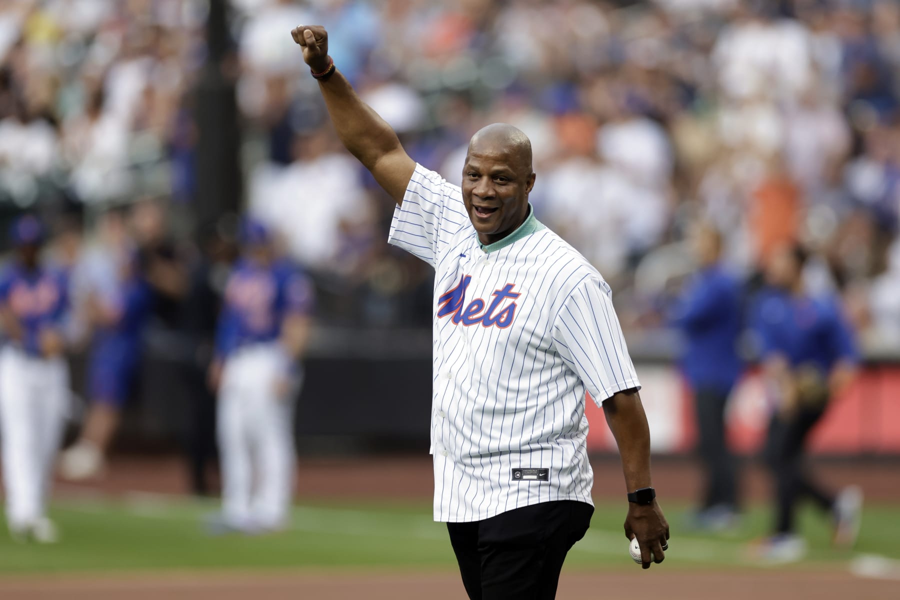 NEW YORK, NY - JULY 26: Former New York Mets Darryl Strawberry throws a ceremonial first pitch at Citi Field on July 26, 2022 in New York City. (Photo by Adam Hunger/Getty Images)