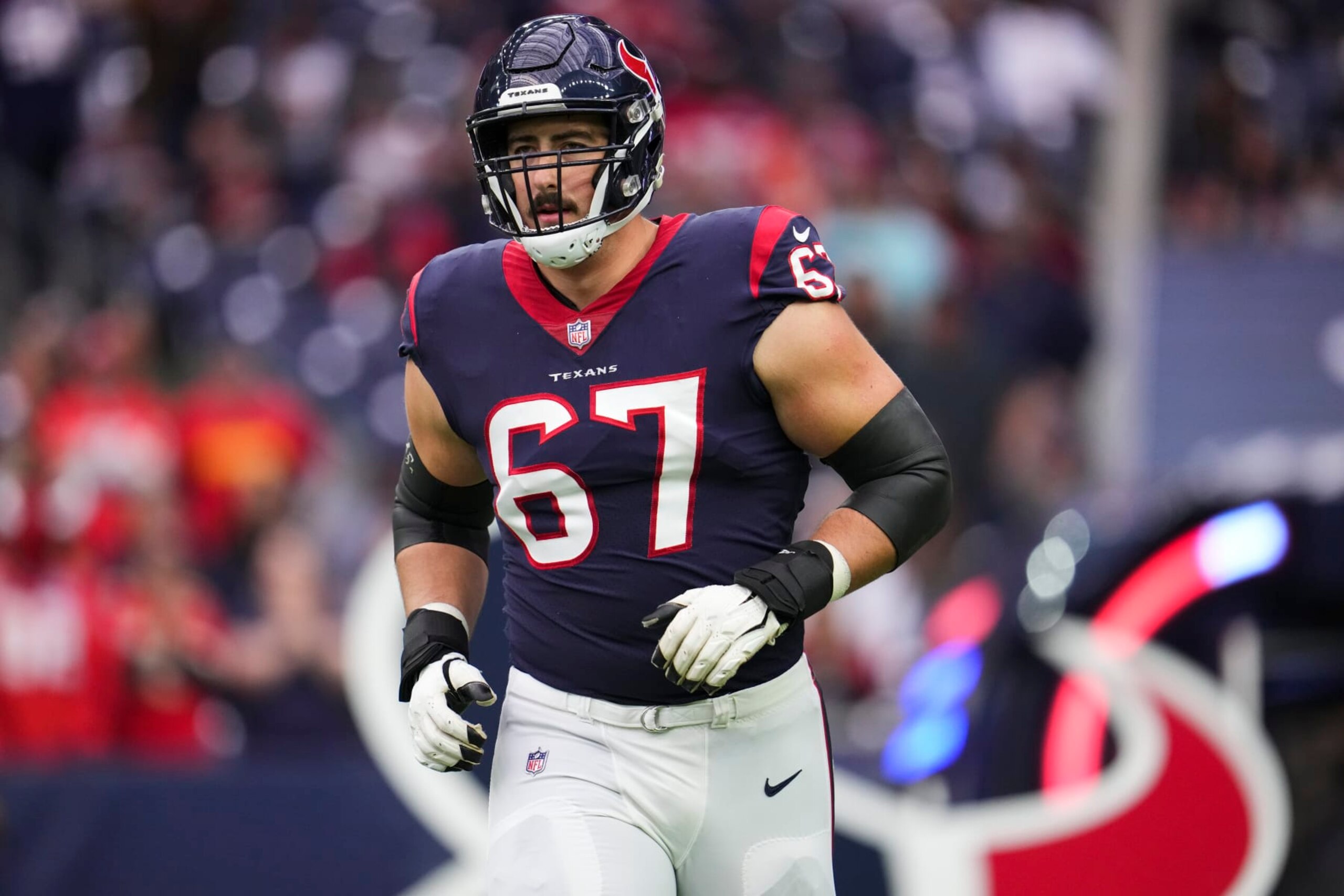 HOUSTON, TX - DECEMBER 18: Charlie Heck #67 of the Houston Texans runs onto the field during introductions against the Kansas City Chiefs at NRG Stadium on December 18, 2022 in Houston, Texas. (Photo by Cooper Neill/Getty Images)