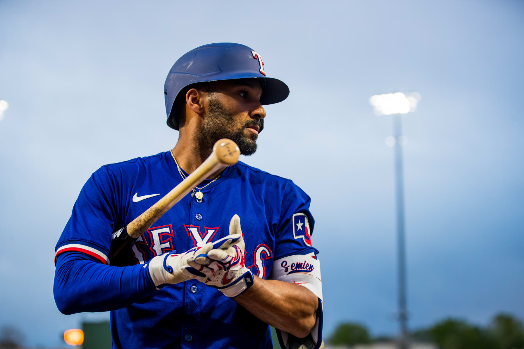 SURPRISE, ARIZONA - MARCH 14: Marcus Semien #2 of the Texas Rangers walks onto the field during the spring training game against the Cincinnati Reds at Surprise Stadium on March 14, 2024 in Surprise, Arizona. (Photo by John E. Moore III/Getty Images)