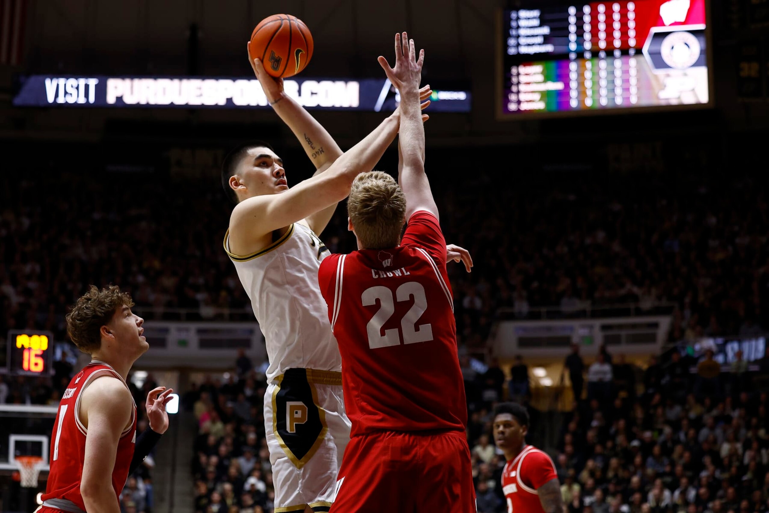 WEST LAFAYETTE, IN - MARCH 10: Purdue Boilermakers center Zach Edey (15) goes up with his shot over Wisconsin Badgers forward Steven Crowl (22) in the first half of play during a mens college basketball game between the Wisconsin Badgers and the Purdue Boilermakers on March 10, 2024 at Mackey Arena in West Lafayette, IN.(Photo by Jeffrey Brown/Icon Sportswire via Getty Images)