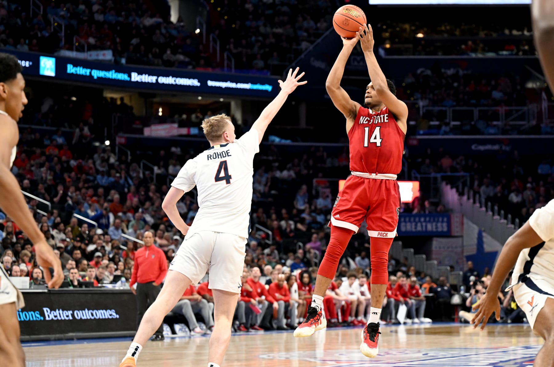 WASHINGTON, DC - MARCH 15: Casey Morsell #14 of the North Carolina State Wolfpack shoots the ball in the first half against Andrew Rohde #4 of the Virginia Cavaliers in the Semifinals of the ACC Men's Basketball Tournament  at Capital One Arena on March 15, 2024 in Washington, DC.  (Photo by Greg Fiume/Getty Images)