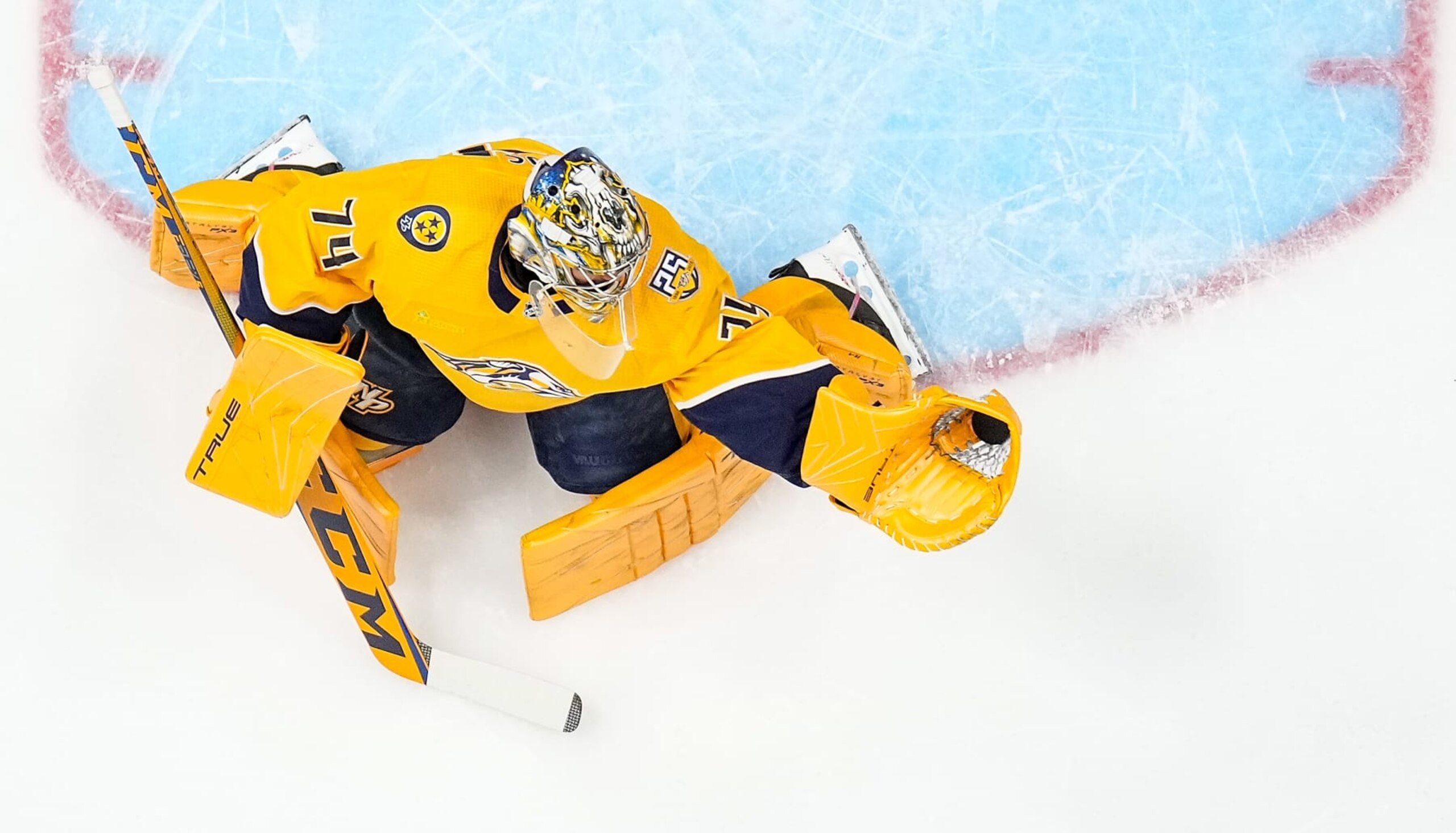 NASHVILLE, TENNESSEE - MARCH 5: Juuse Saros #74 of the Nashville Predators makes a glove save in warmups prior to an NHL game against the Montreal Canadiens at Bridgestone Arena on March 5, 2024 in Nashville, Tennessee. (Photo by John Russell/NHLI via Getty Images)
