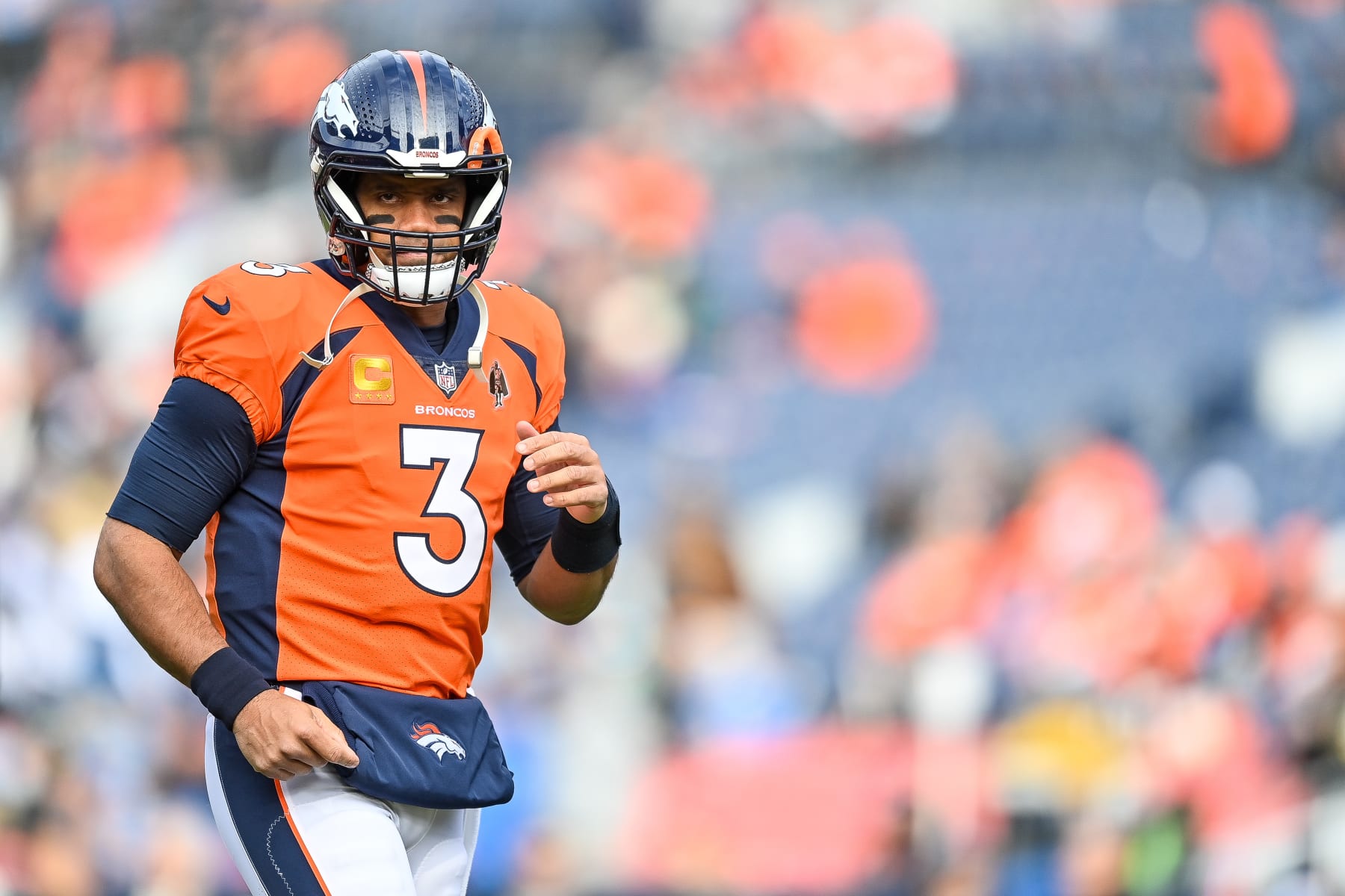 DENVER, COLORADO - DECEMBER 31:  Quarterback Russell Wilson #3 of the Denver Broncos looks on before a game against the Los Angeles Chargers at Empower Field at Mile High on December 31, 2023 in Denver, Colorado. (Photo by Dustin Bradford/Getty Images)