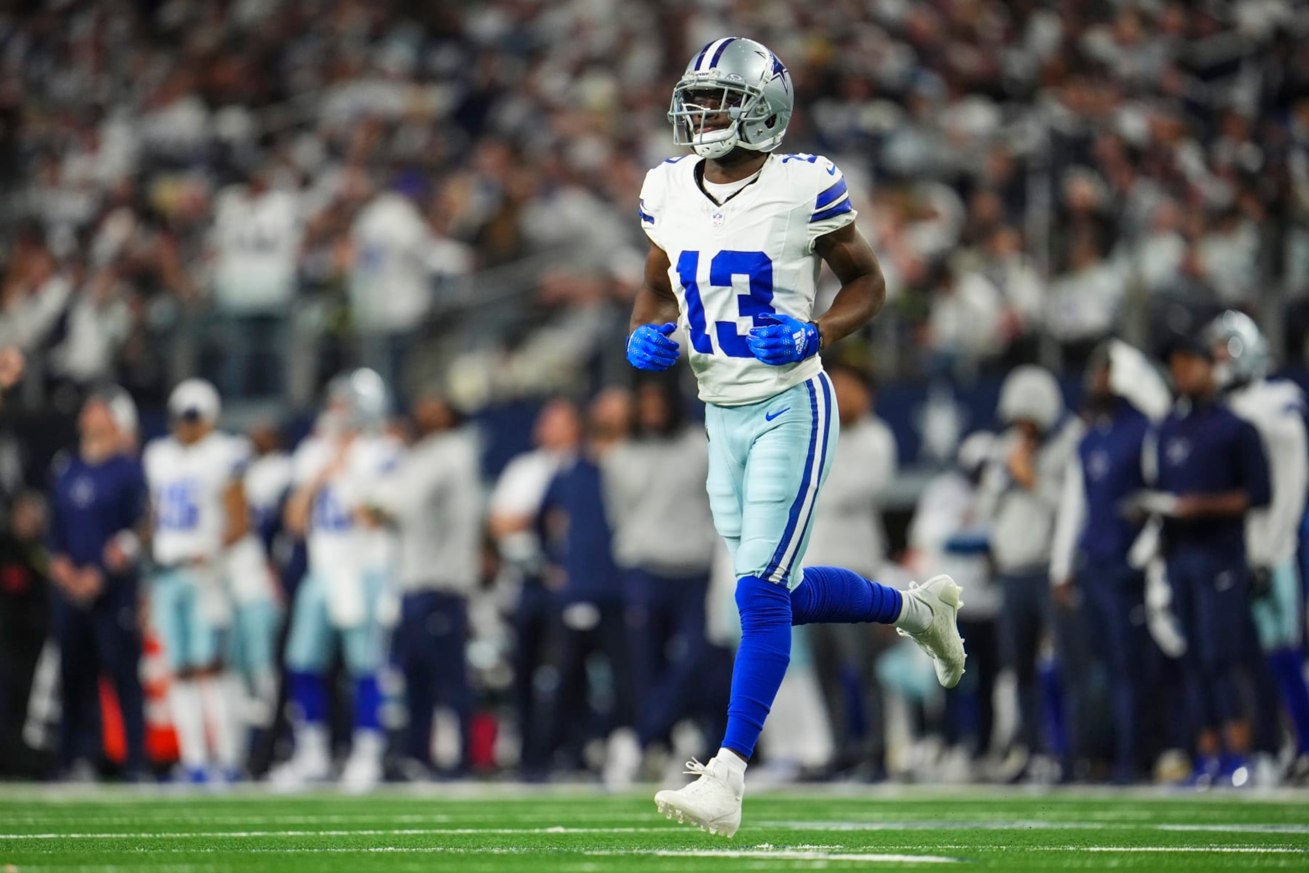 DALLAS, TX - JANUARY 14: Michael Gallup #13 of the Dallas Cowboys runs across the field during an NFL wild-card playoff football game against the Green Bay Packers at AT&T Stadium on January 14, 2024 in Dallas, Texas. (Photo by Cooper Neill/Getty Images) DALLAS, TX - JANUARY 14: Michael Gallup #13 of the Dallas Cowboys runs across the field during an NFL wild-card playoff football game against the Green Bay Packers at AT&T Stadium on January 14, 2024 in Dallas, Texas. (Photo by Cooper Neill/Getty Images)