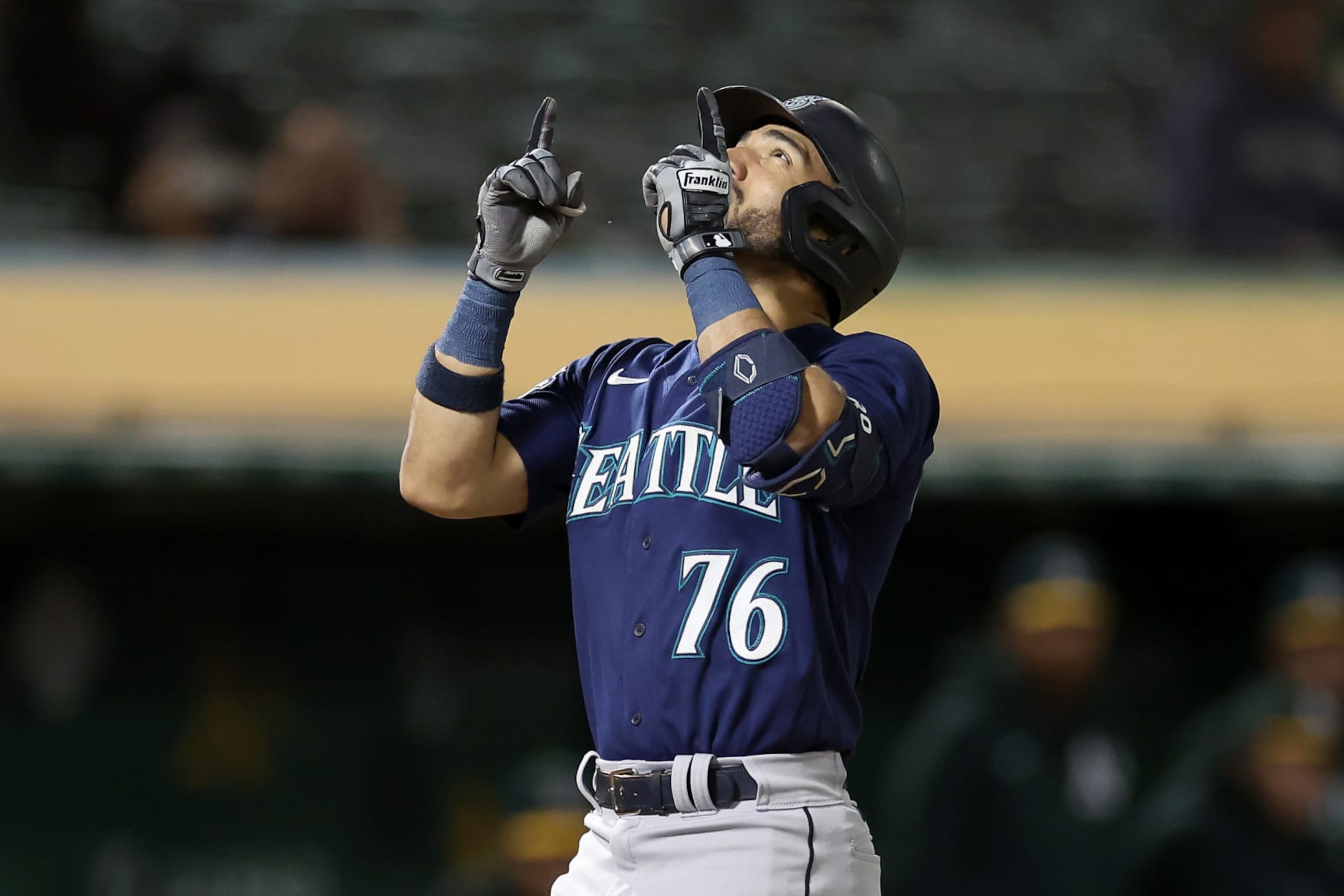 OAKLAND, CALIFORNIA - SEPTEMBER 18: Jose Caballero #76 of the Seattle Mariners points to the sky after he hit a two-run home run against the Oakland Athletics in the fourth inning at RingCentral Coliseum on September 18, 2023 in Oakland, California. (Photo by Ezra Shaw/Getty Images)