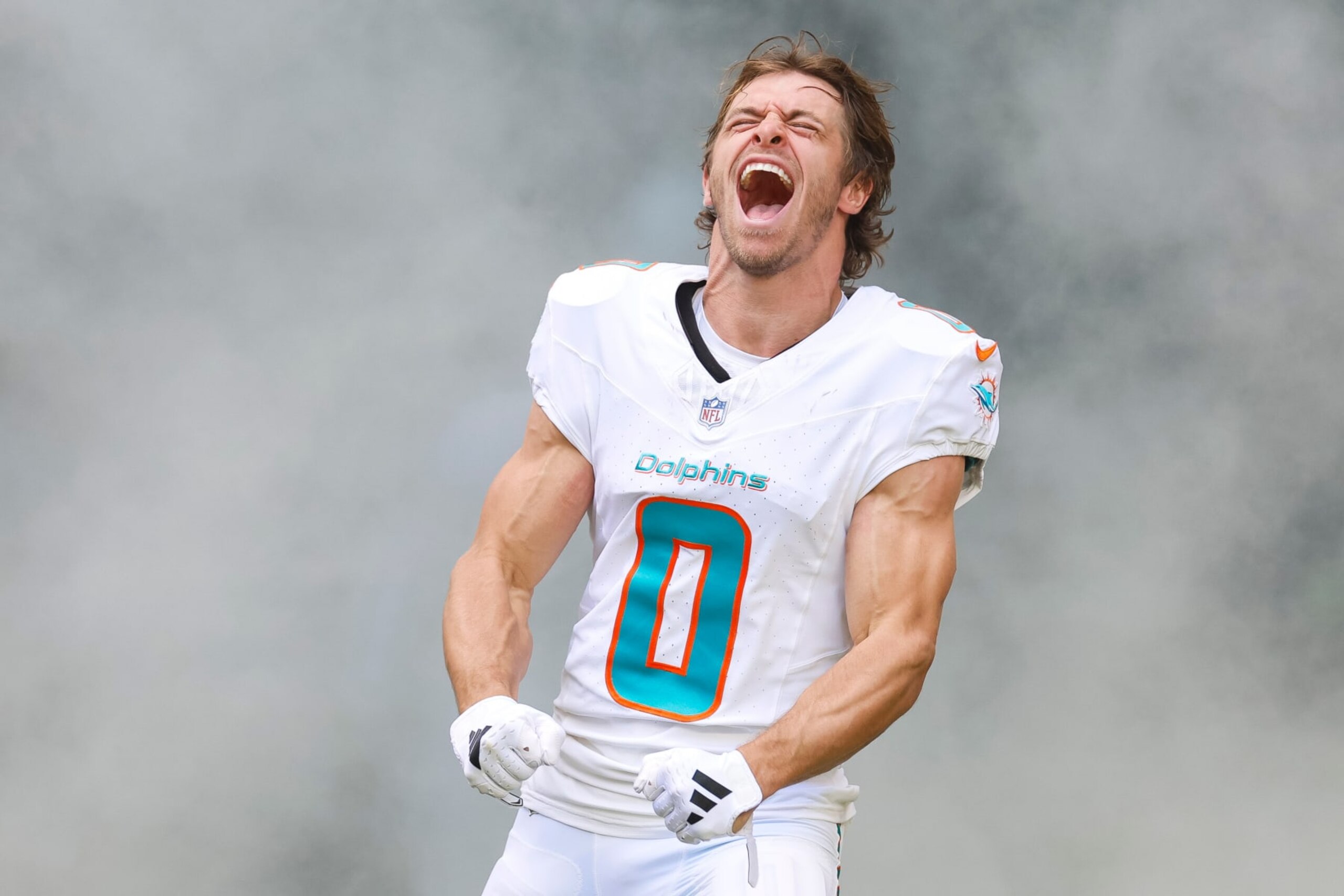 MIAMI GARDENS, FLORIDA - DECEMBER 17: Braxton Berrios #0 of the Miami Dolphins runs out of the tunnel during player introductions prior to a game against the New York Jets at Hard Rock Stadium on December 17, 2023 in Miami Gardens, Florida. (Photo by Brandon Sloter/Image Of Sport/Getty Images)