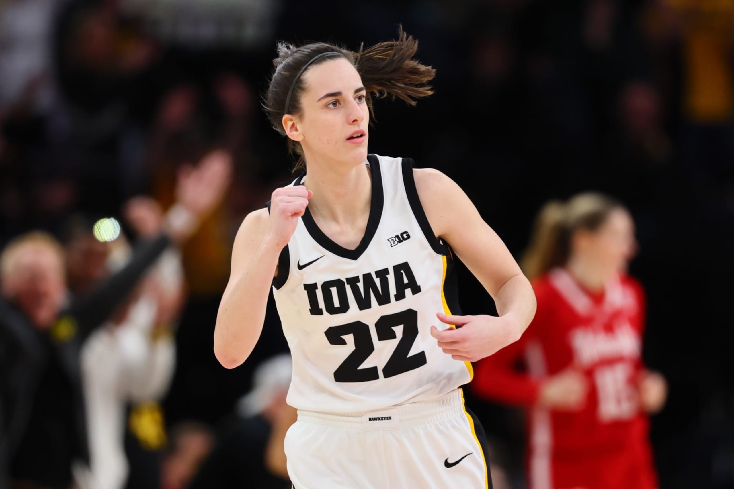 MINNEAPOLIS, MINNESOTA - MARCH 10: Caitlin Clark #22 of the Iowa Hawkeyes reacts after a three point basket in the first half against the Nebraska Cornhuskers during the Big Ten Women's Basketball Tournament Championship at Target Center on March 10, 2024 in Minneapolis, Minnesota. (Photo by Adam Bettcher/Getty Images)
