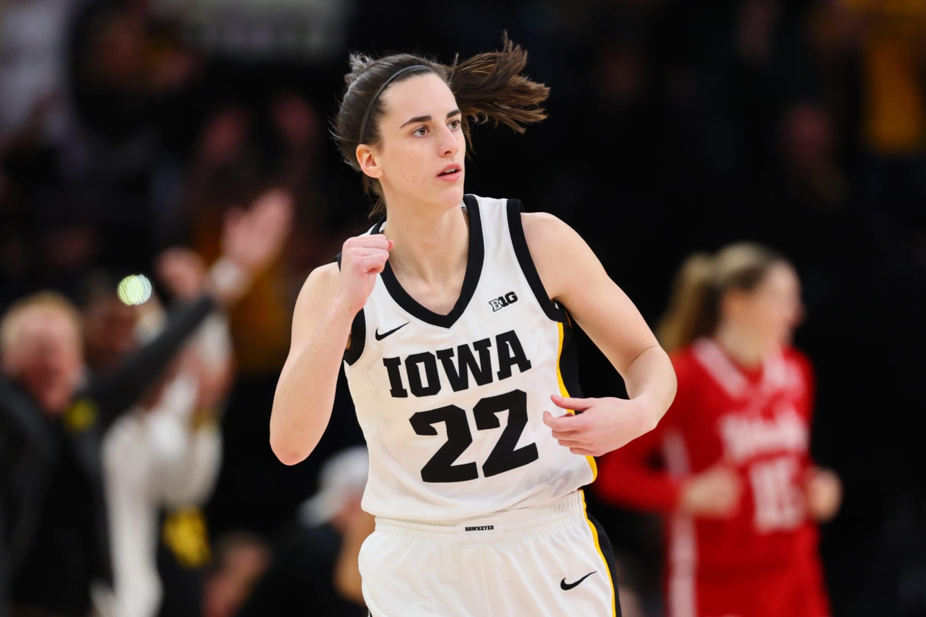 MINNEAPOLIS, MINNESOTA - MARCH 10: Caitlin Clark #22 of the Iowa Hawkeyes reacts after a three point basket in the first half against the Nebraska Cornhuskers during the Big Ten Women's Basketball Tournament Championship at Target Center on March 10, 2024 in Minneapolis, Minnesota. (Photo by Adam Bettcher/Getty Images)