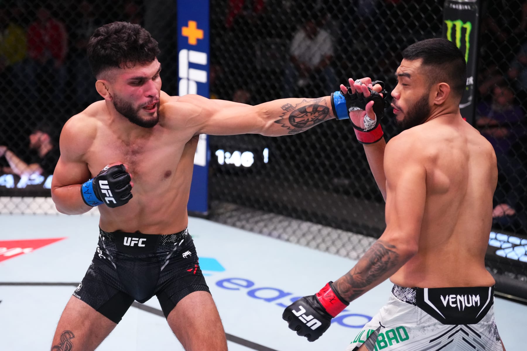 LAS VEGAS, NEVADA - MARCH 16: (L-R) Danny Silva punches in their featherweight fight during the UFC Fight Night event at UFC APEX on March 16, 2024 in Las Vegas, Nevada. (Photo by Jeff Bottari/Zuffa LLC via Getty Images)